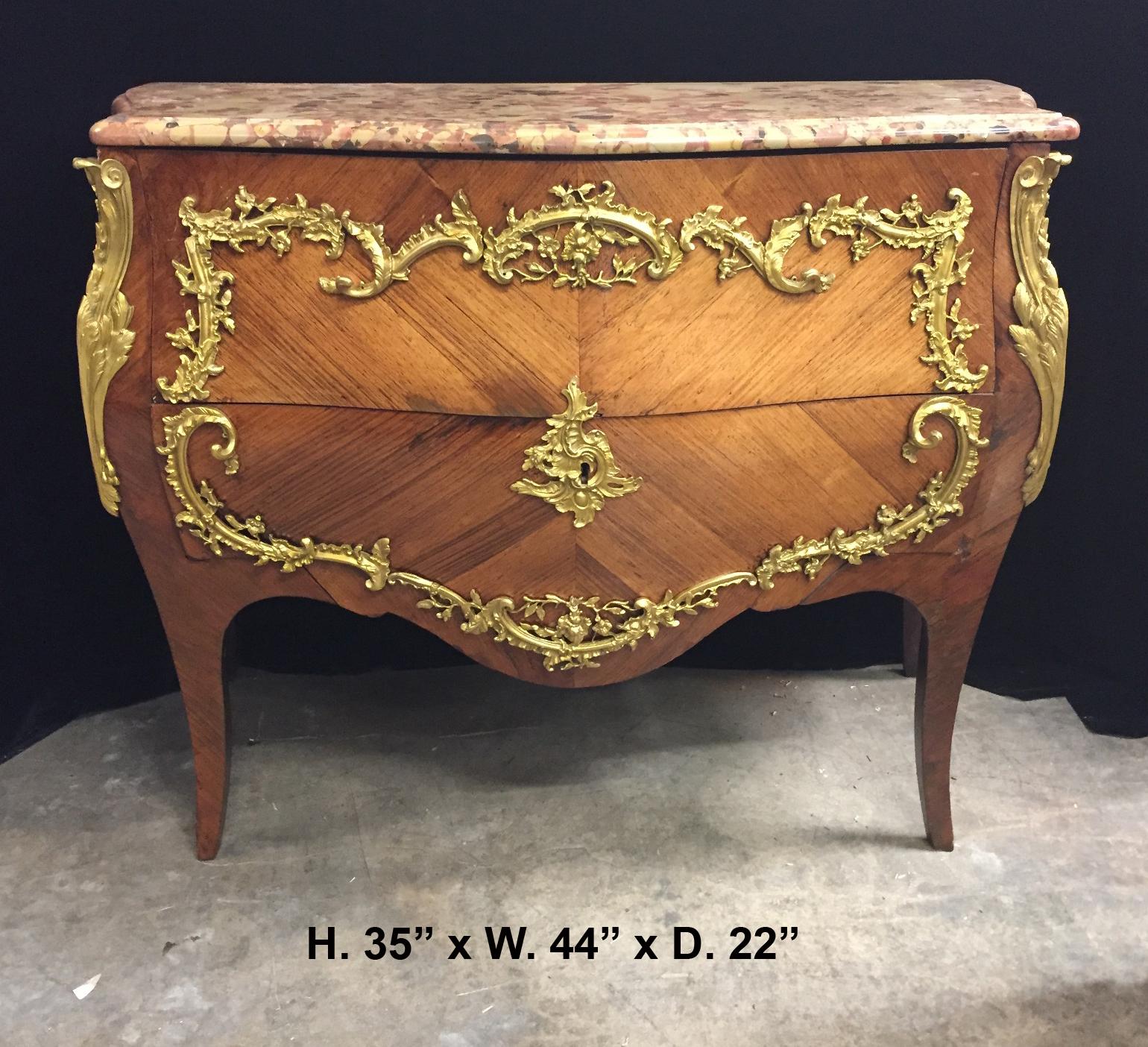 Exquisite 19th century French Louis XV style bronze-mounted commode with marble top. Signed JVHD on bronze mounts.
The serpentine-fronted mottled Breche d'Alep marble top is over two long kingwood veneered drawers mounted with scrolled ormolu