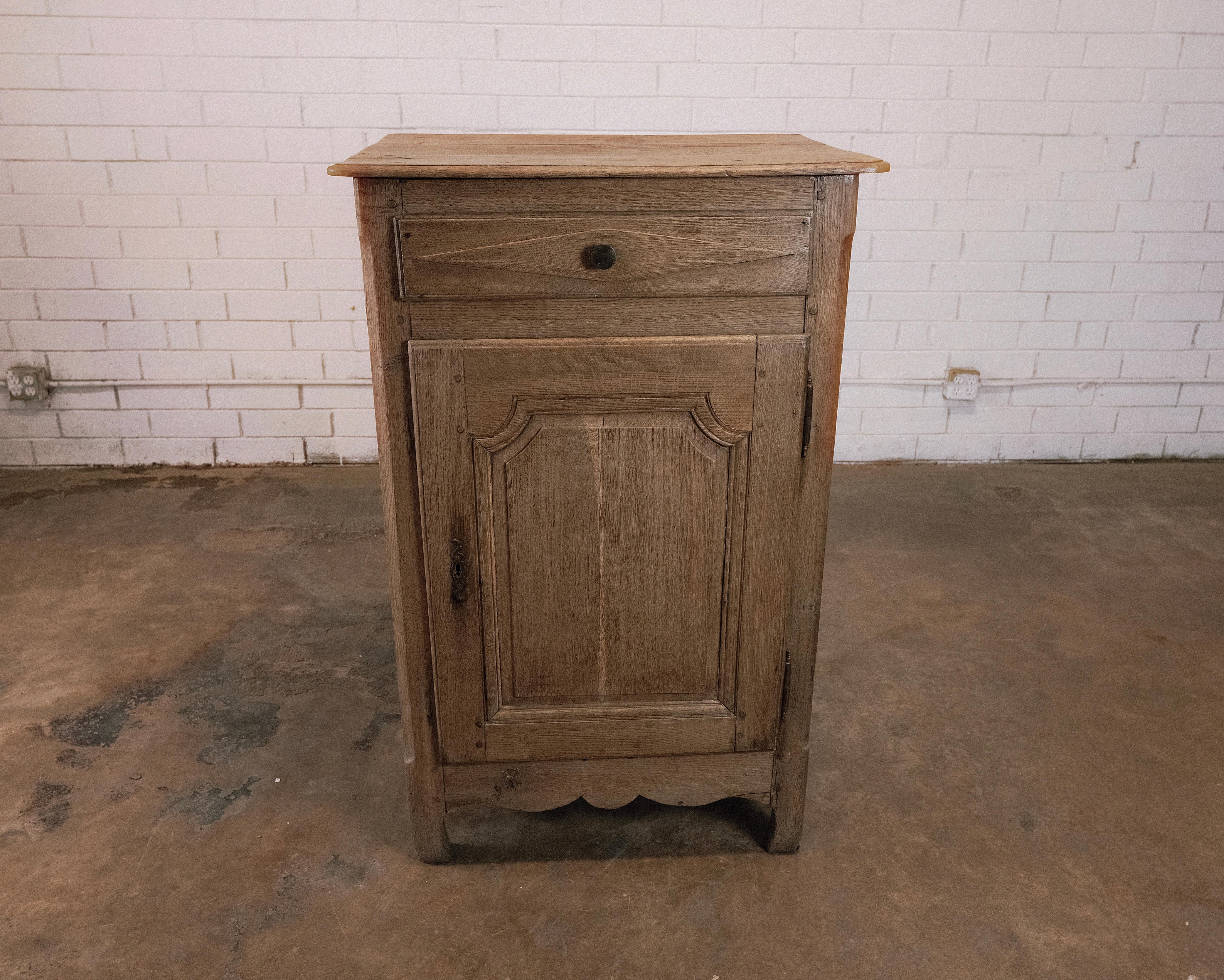 Step into the world of refined culinary elegance with this charming French Louis XV style confiture, a single-door cabinet designed for the storage of jams, preserves, and other culinary delights. This piece embodies the essence of the Louis XV era,