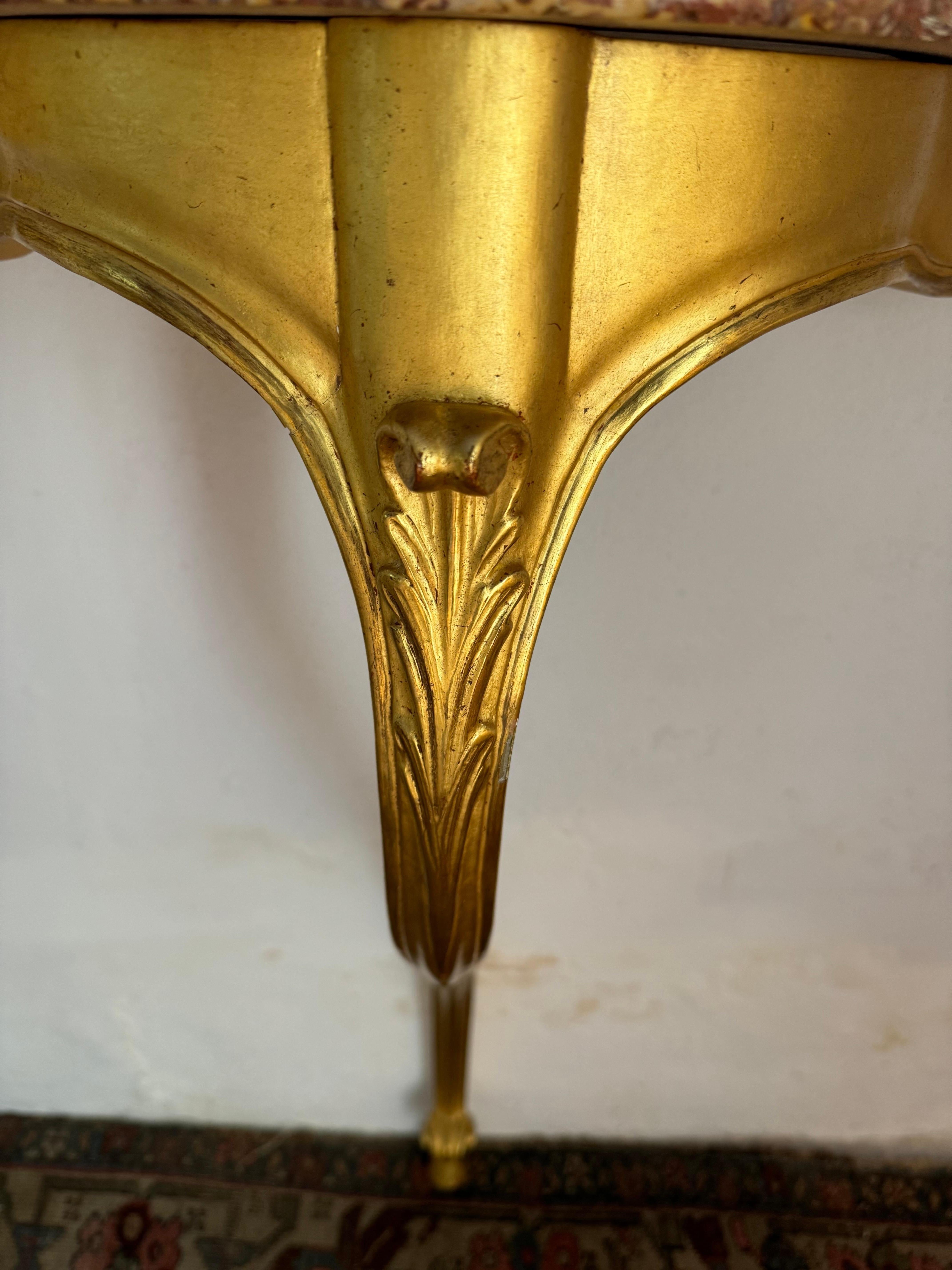 A very pretty and elegant French Louis XV style gilt wooden console. Great quality minor scuffs to the gilding. Wall mounted.