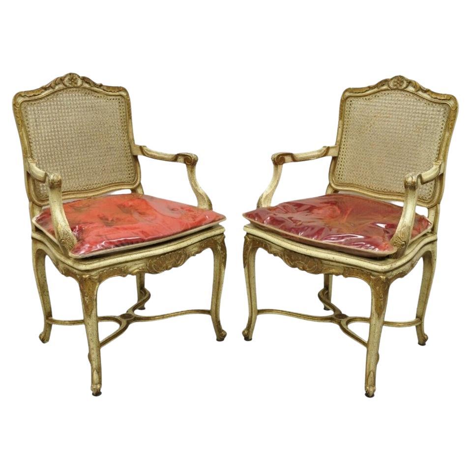 French Louis XV Style Cream Painted Carved Wood Cane Fauteuil Arm Chairs - Pair