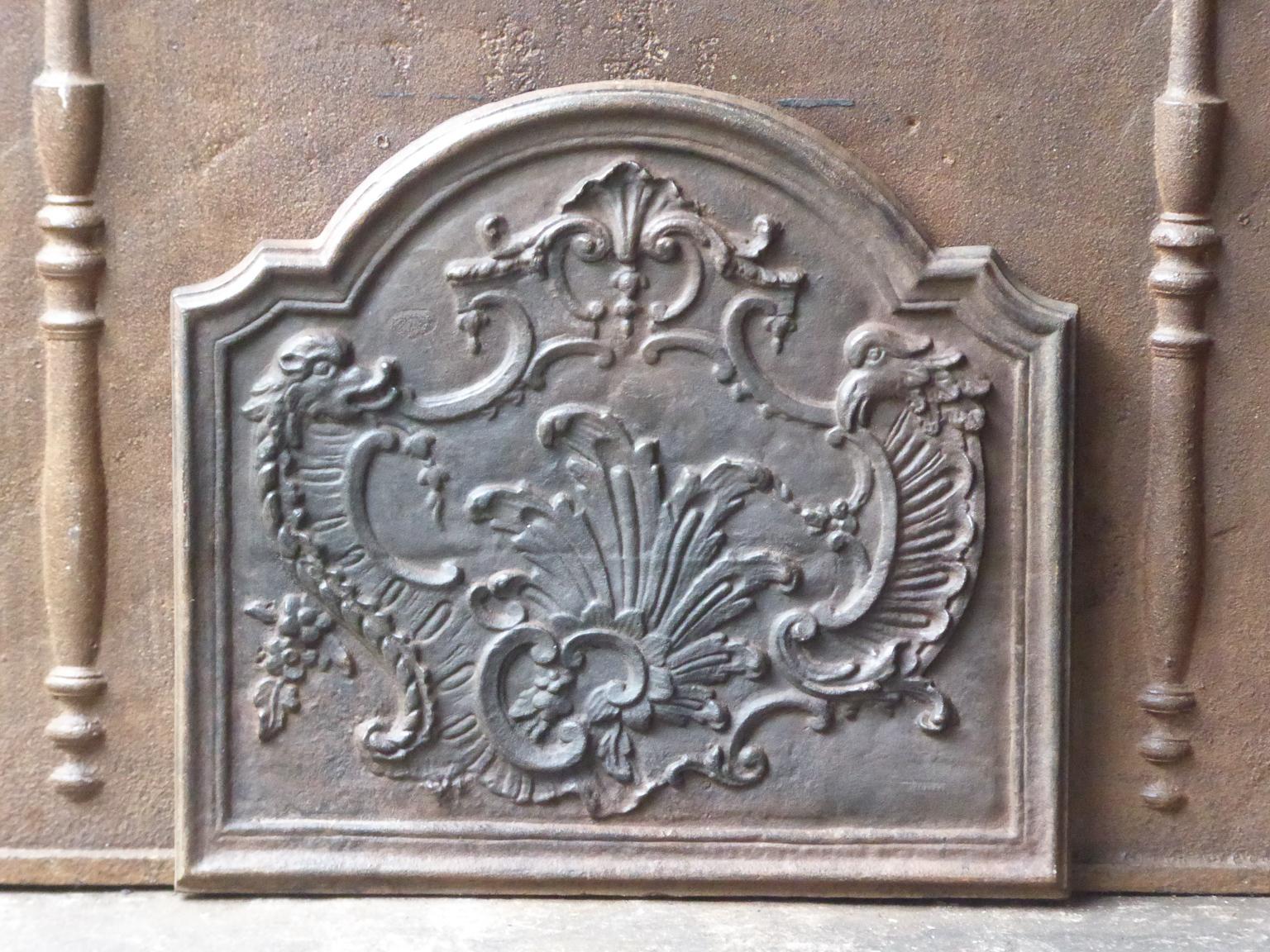 Beautiful French fireback with Louis XV style decoration.




   


.