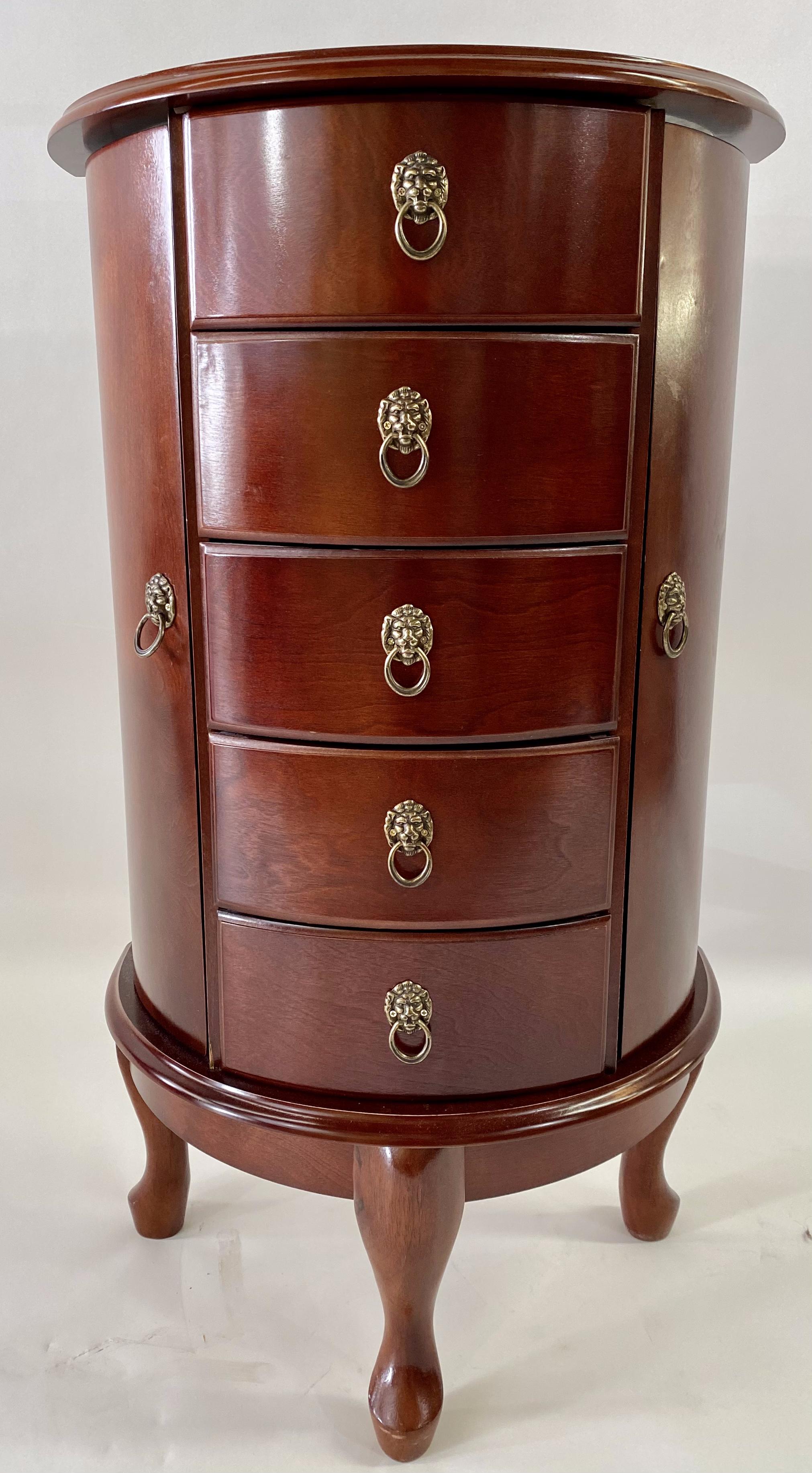 A lovely and very rare side end  or side table converting to to a vanity and jewelry chest. The demi-lune shaped side table offers four drawers with compartments to nicely display  and organize all type of jewelry and two side cabinet doors opening