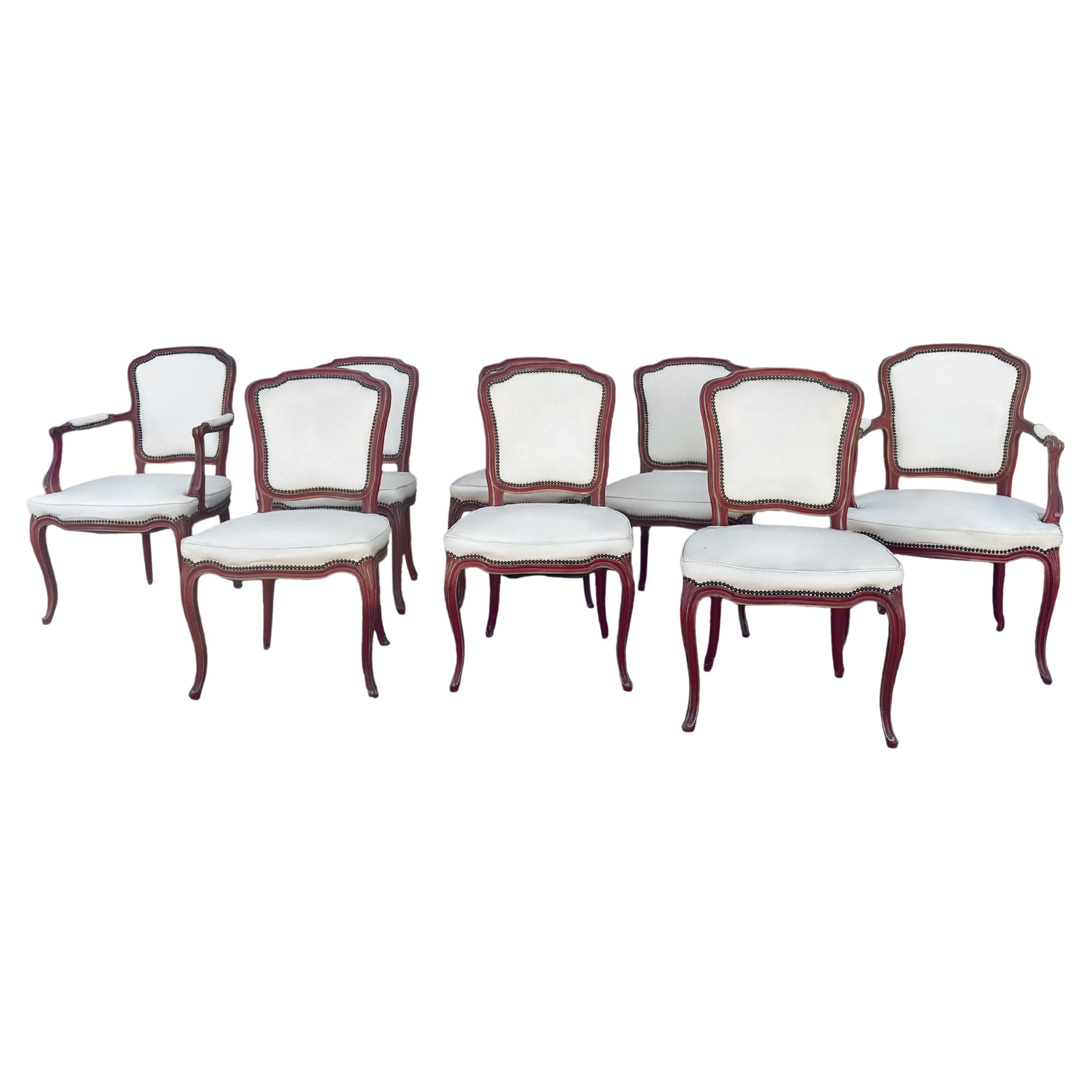French Louis XV style dining chairs in red distressed paint with nailheads