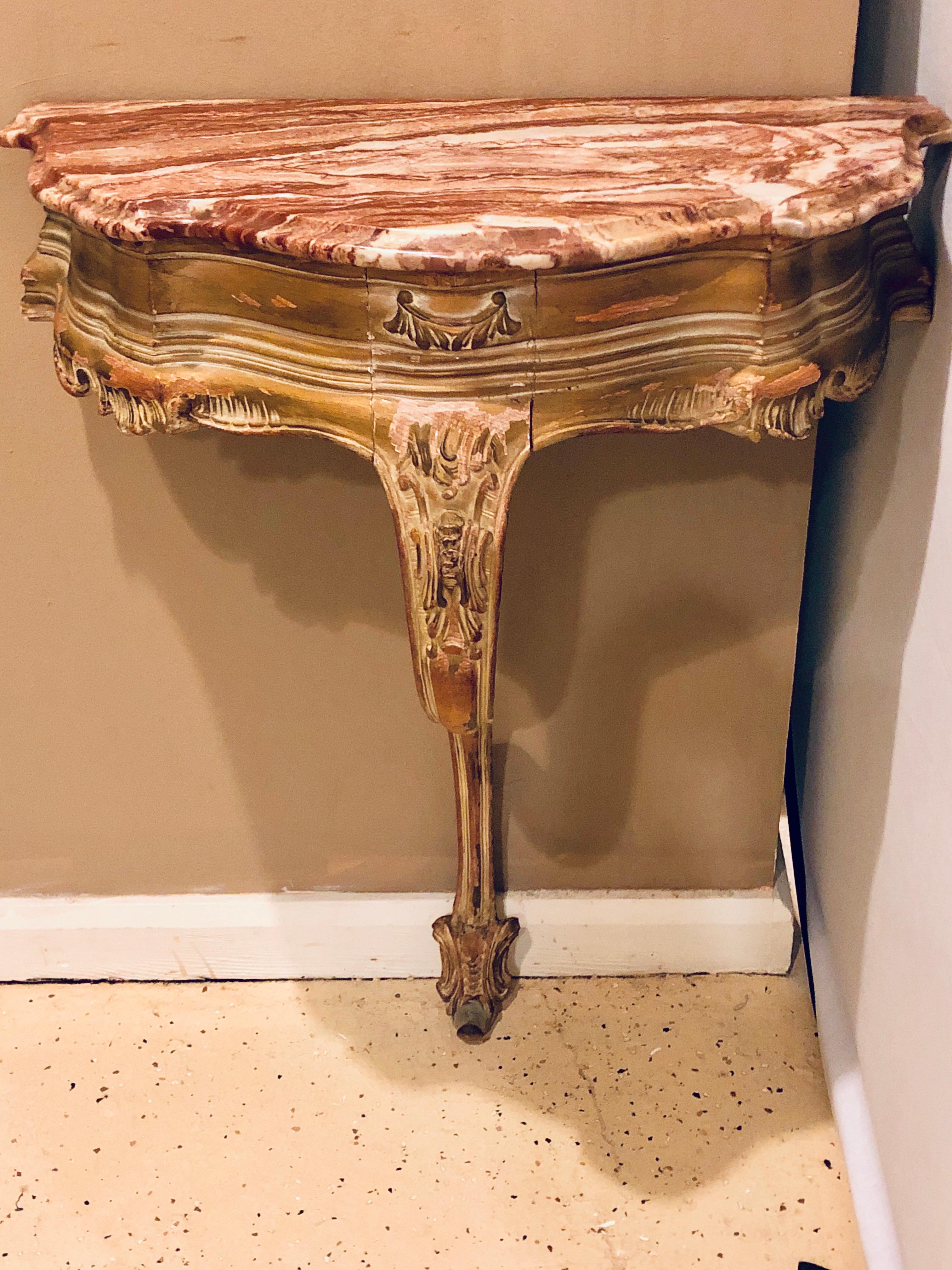  French Louis XV Style Distressed Antique Demi Lune Console with a Rouge Marble Top. This is a simply stunning worn and distressed late 19th century marble top console table having a demi lune form in the Louis XV Style. 