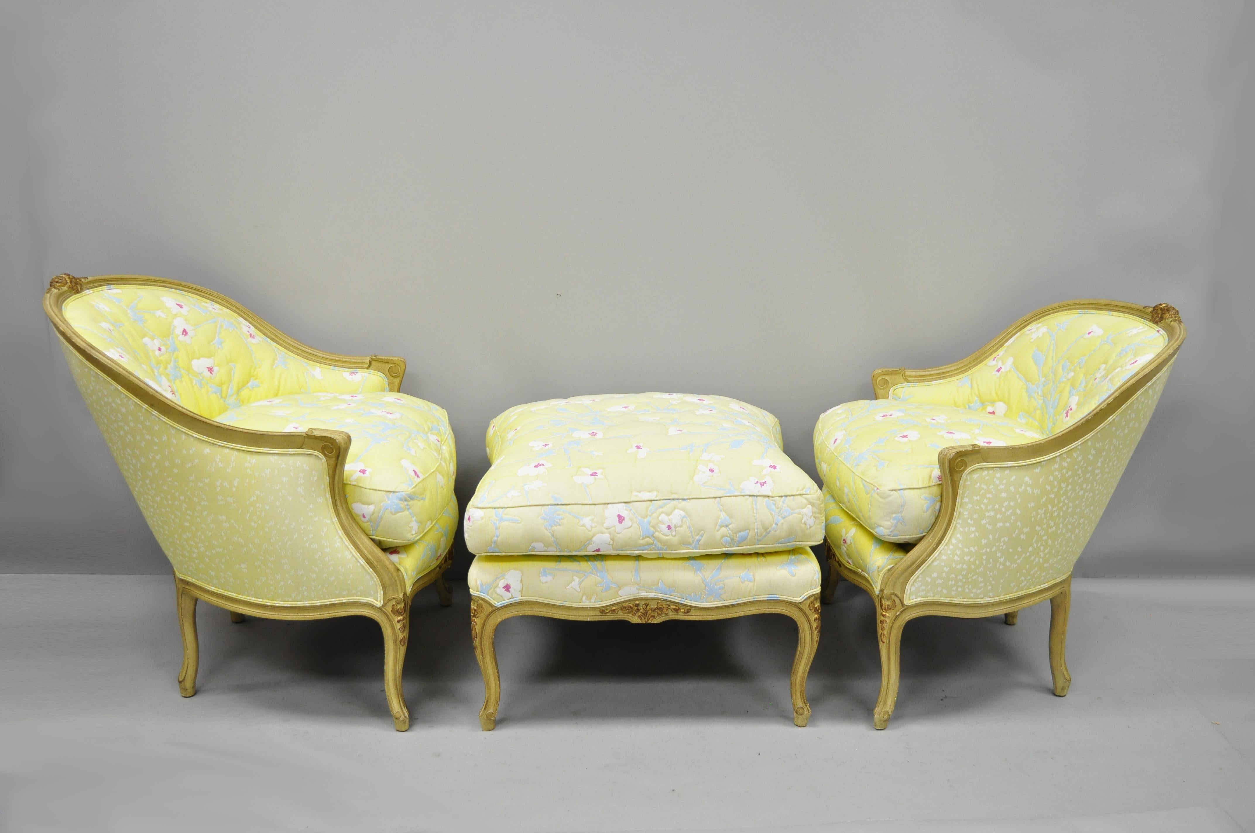 French Louis XV style Duchesse Brisee chaise pair of bergere chairs and ottoman. Listing includes 3-piece set consisting of His & Her Bergere chairs and ottoman, cream and gold painted finish, yellow and blue floral upholstery, solid wood frames,
