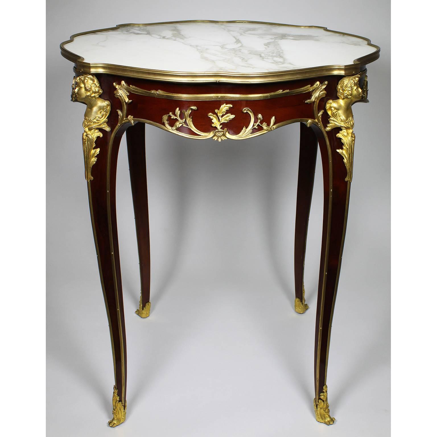 A very fine French Louis XV style figural gilt-bronze mounted mahogany guèridon side-table fitted with a mottled white and rouge marble-inset top, attributed to François Linke (1855-1946). The ormolu signed: F. Linke and stamped on the back 