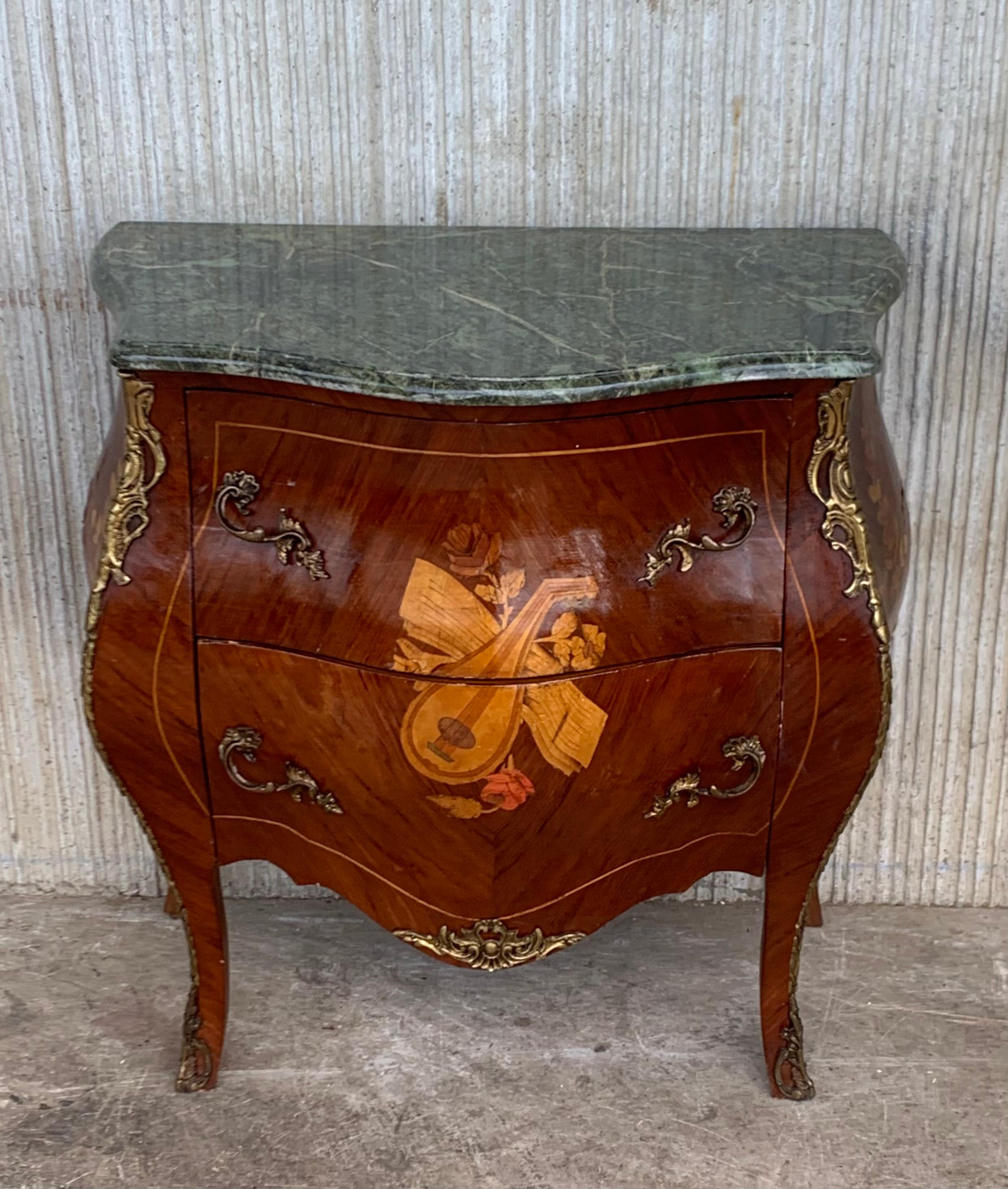 French Louis XV style kingwood veneer commode, the shaped marble top above a bombe case with ormolu bronze mounts, highly decorated throughout with marquetry inlay with two drawers, on short cabriole legs.


 