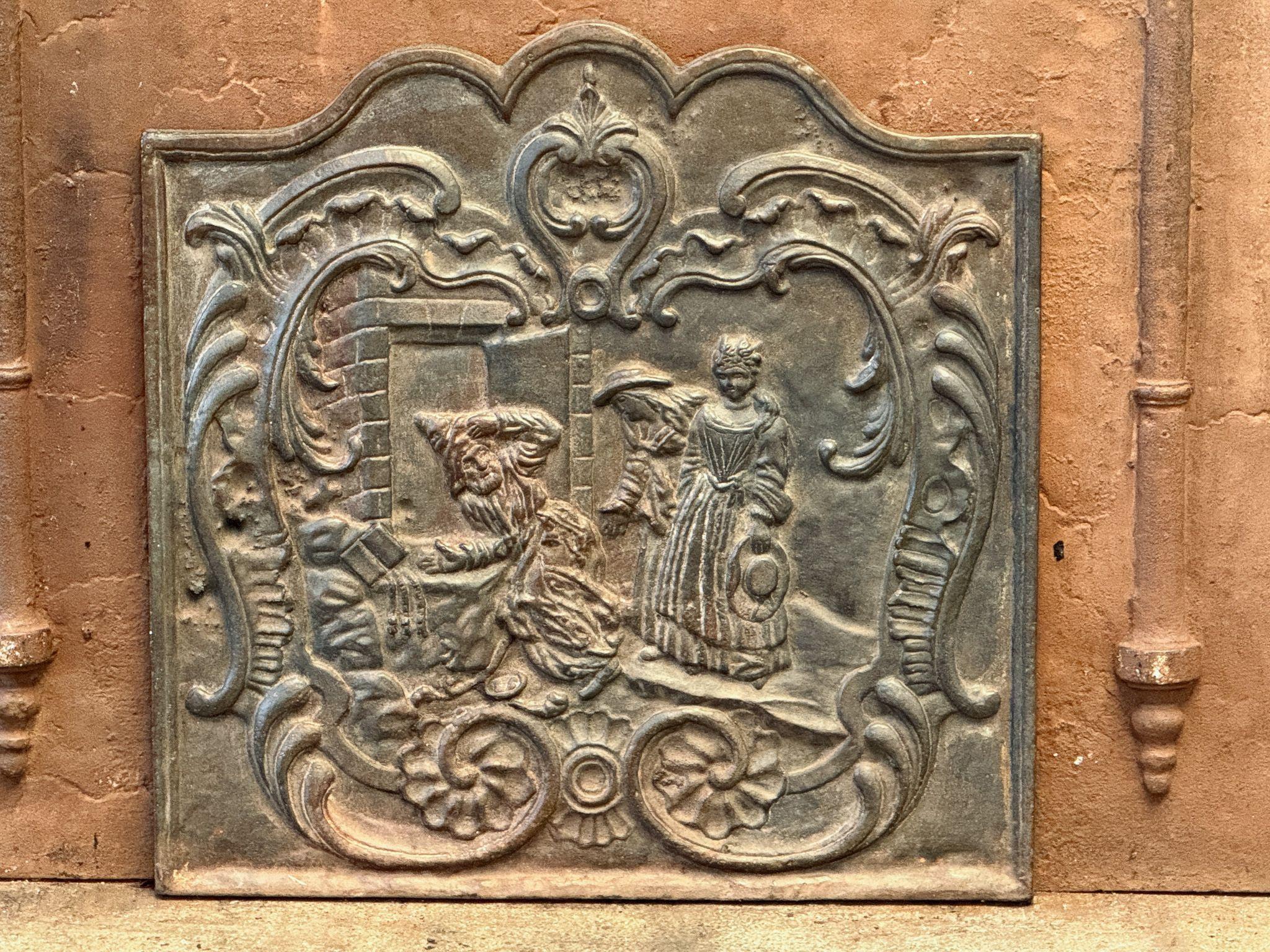 20th century Louis XV Style fireback.

The fireback is made of cast iron and has a brown patina. It can be made black / pewter upon request at no extra costs. It is in a good condition, no cracks.