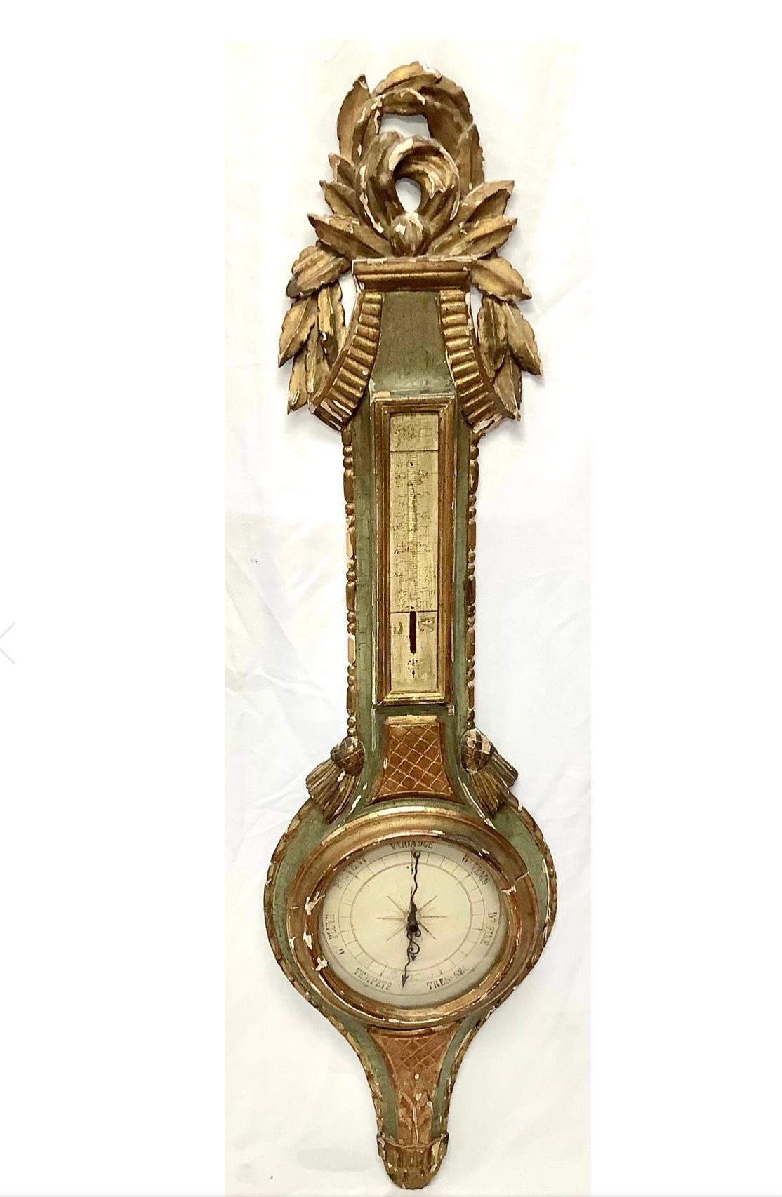 19th Century French Louis XV style gilt and painted wood barometer. While not in working order, barometer has that wonderful old 'chippy' peeling patina. The carved wood frame and gilt and painted surface adds charm to any decor.
 