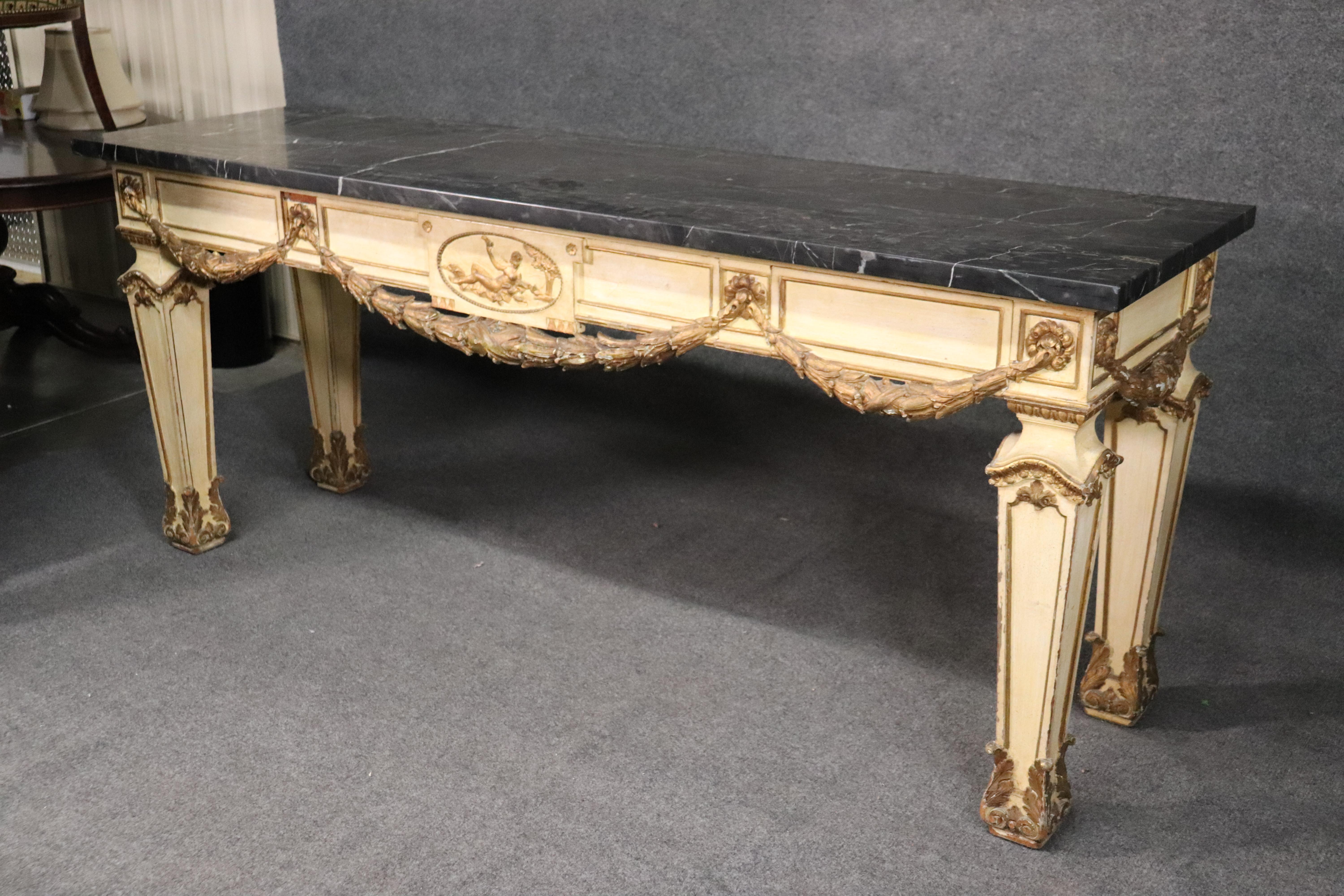 This is a grand buffet that can also be used as a console table because of its design. It was outfitted with gorgeous purple velvet lined drawers for silverware, but can easily be a console. The table measures 85 wide x 25 deep x 36 tall. The table