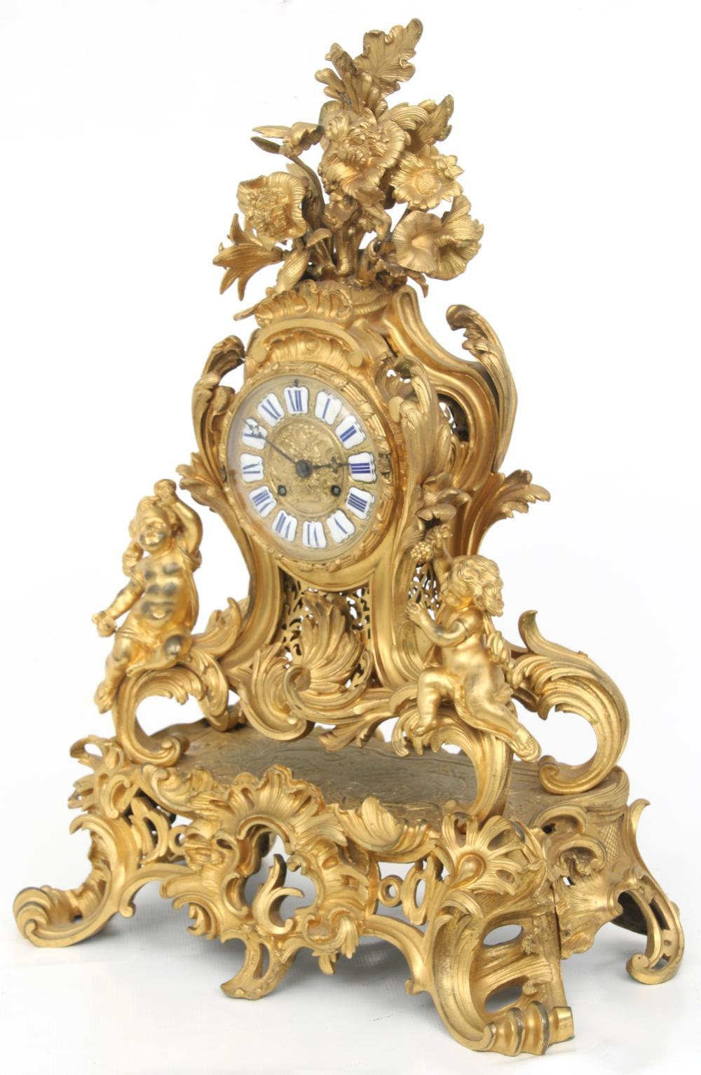 Finest quality French 19 century Louis XV style gilt bronze clock and candelabra.
  