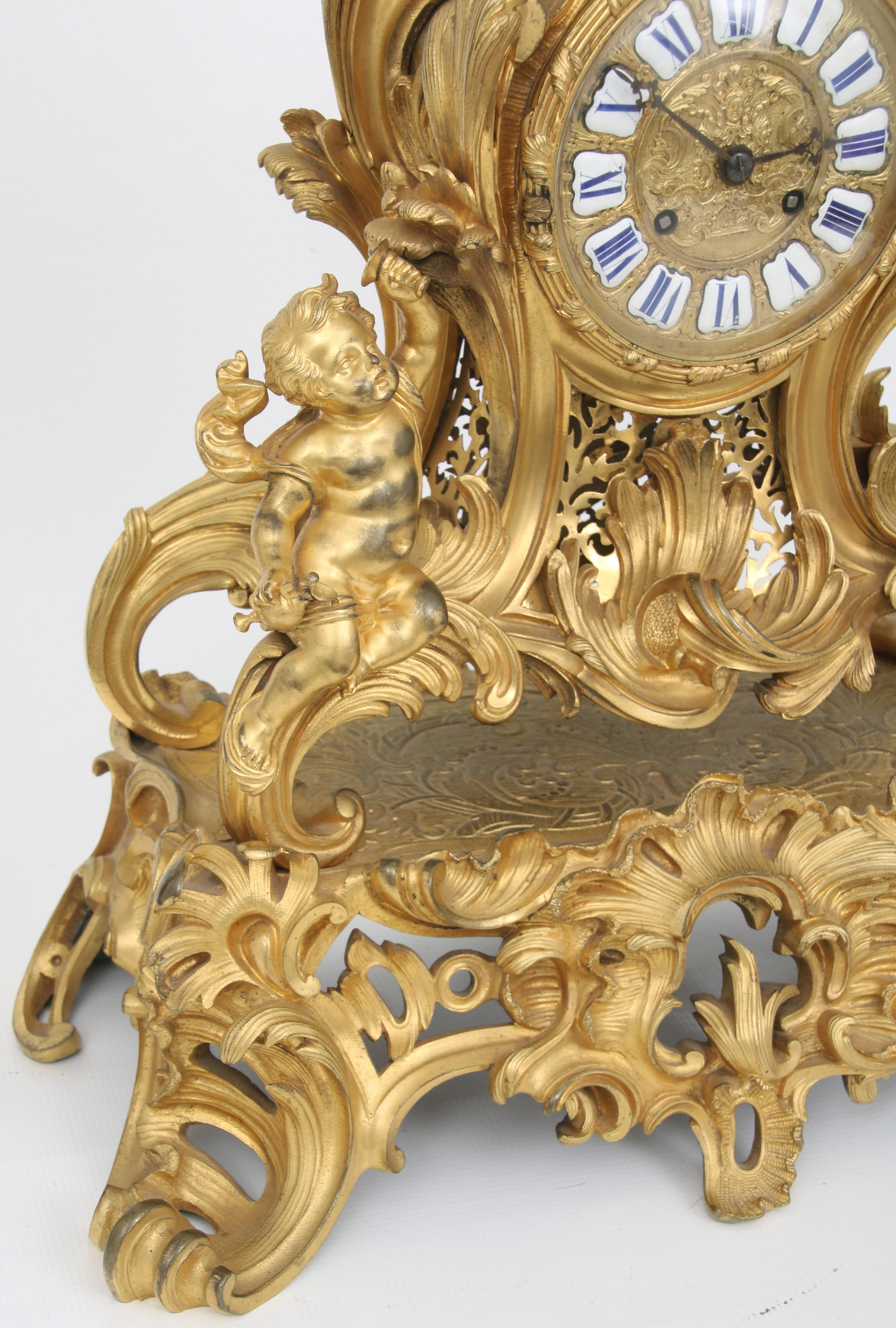 French Louis XV Style Gilt and patinated Bronze Clock and Candelabra 1