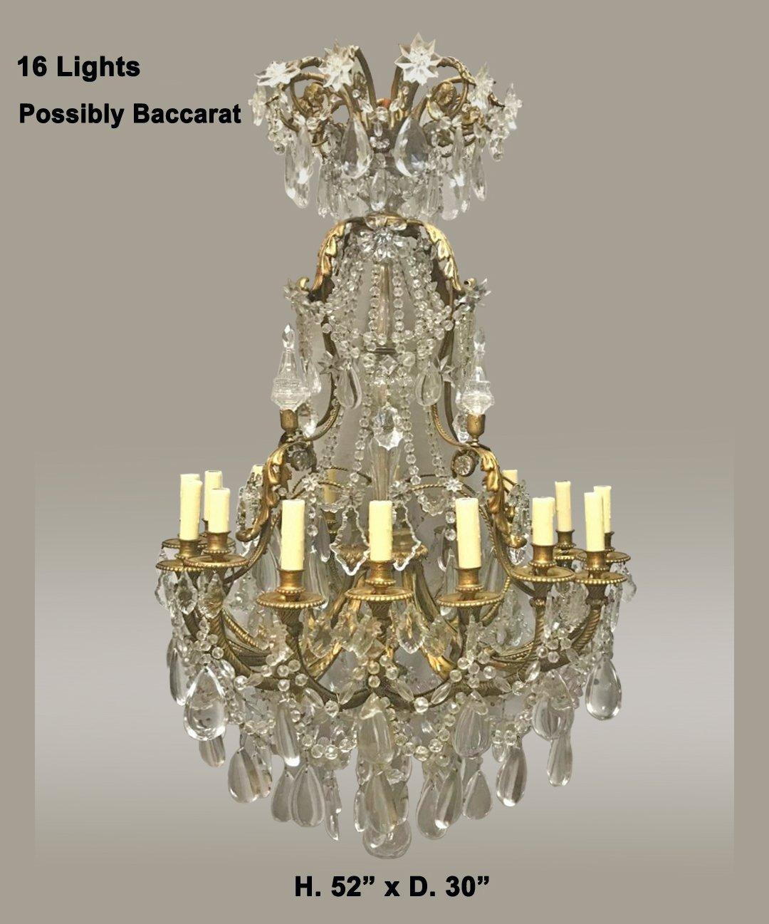 Exquisite French Louis XV style gilt bronze and crystal sixteen-light chandelier.
Late 19th century.
Possibly Baccarat (no signature apparent). 

The fine chandelier is surmounted by a gilt scrolling rosette-decorated crown dressed with various
