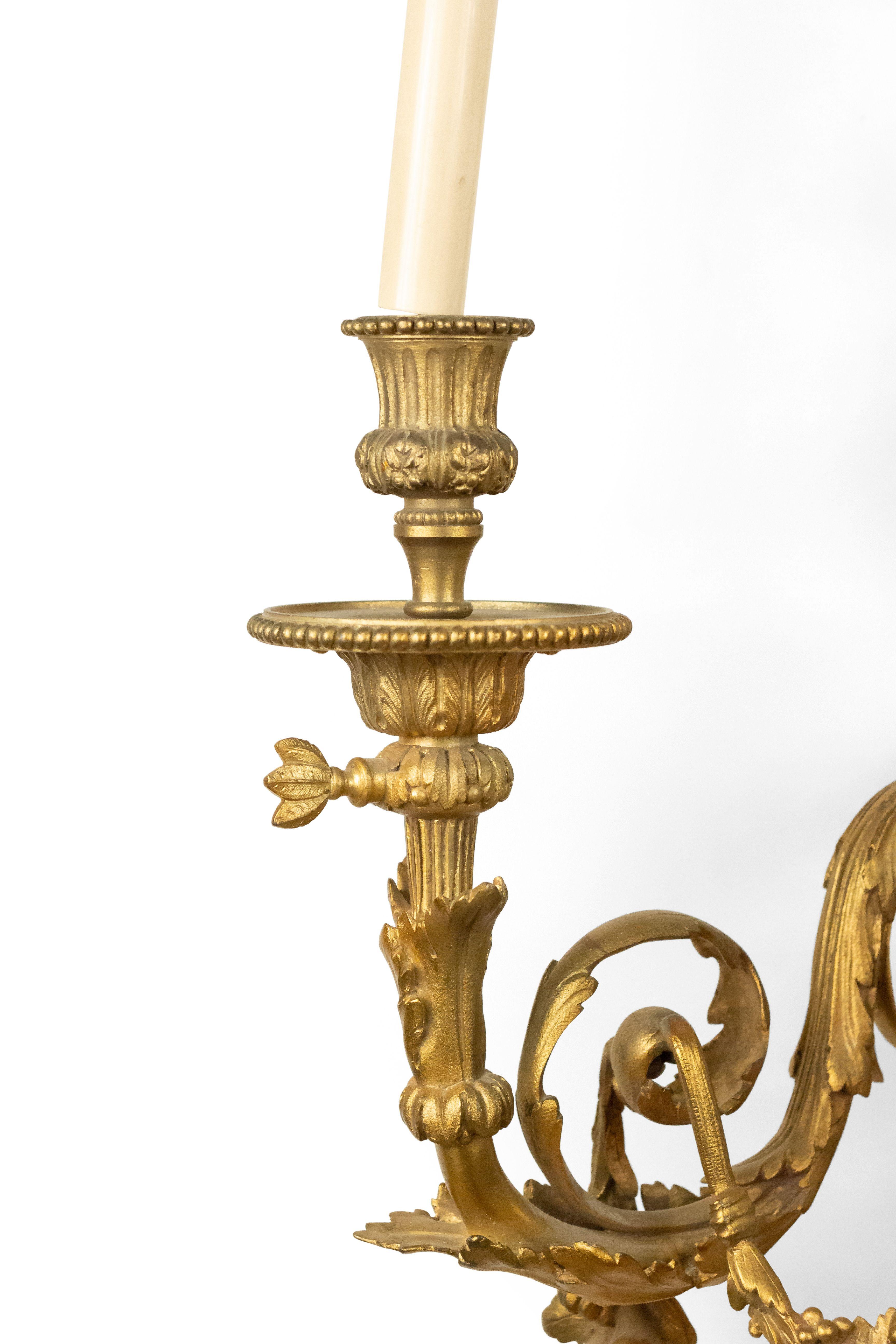 French Louis XV-Style (19th century) gilt bronze 3 arm wall sconce with scroll and festoon design with a urn top. (originally gas).
   