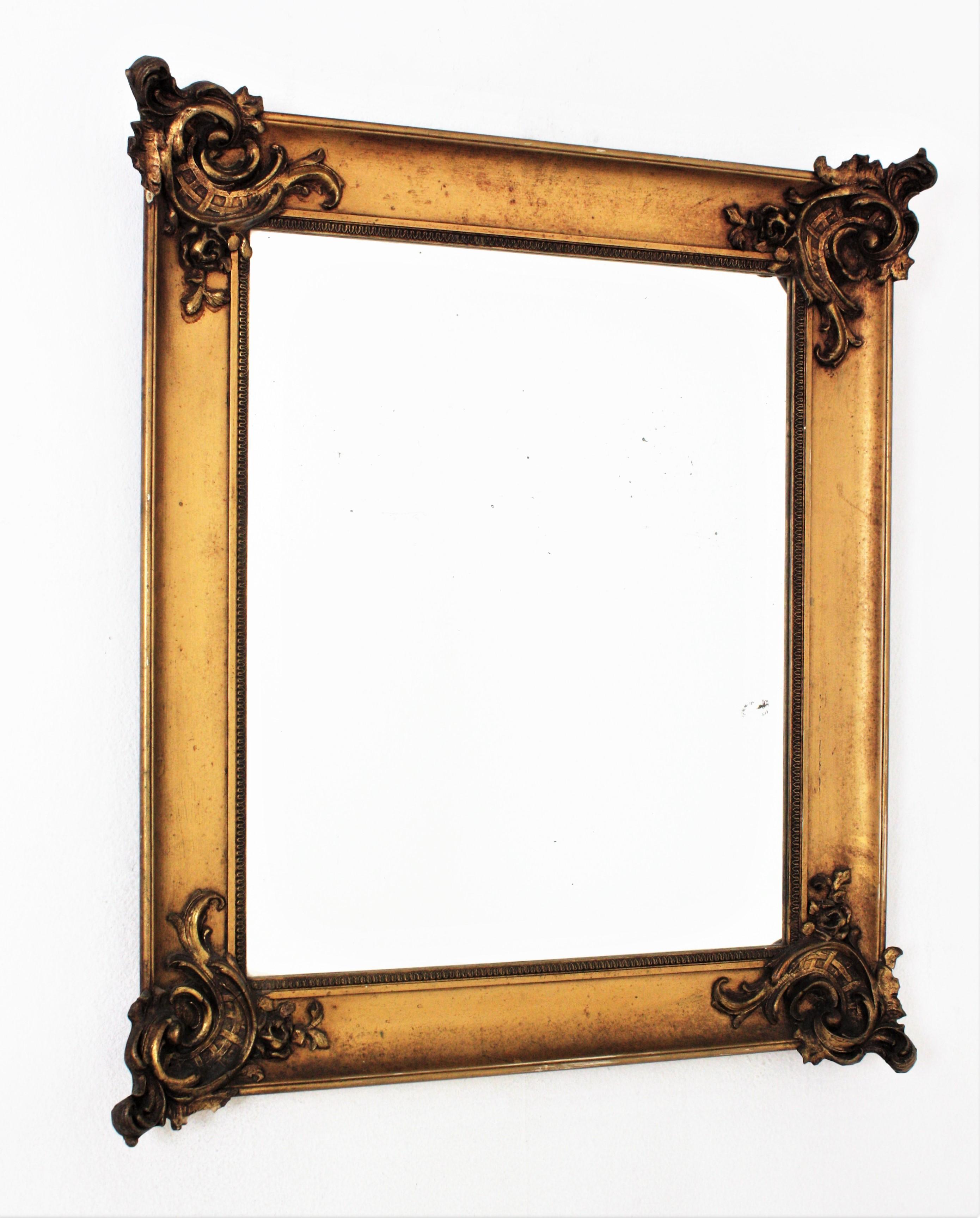 Louis XV style Rectangular mirror, France, 1930s-1940s.
Beautiful gilt wall mirror with foliage decorations at the corners, the style of Louis XV
Measures: 80 cm H x 69 cm W x 9 cm D
Glass measures: 57,5 cm H x 47,5 cm W

We are specialists in