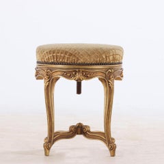 French Louis XV style giltwood and upholstered piano stool C 1900.