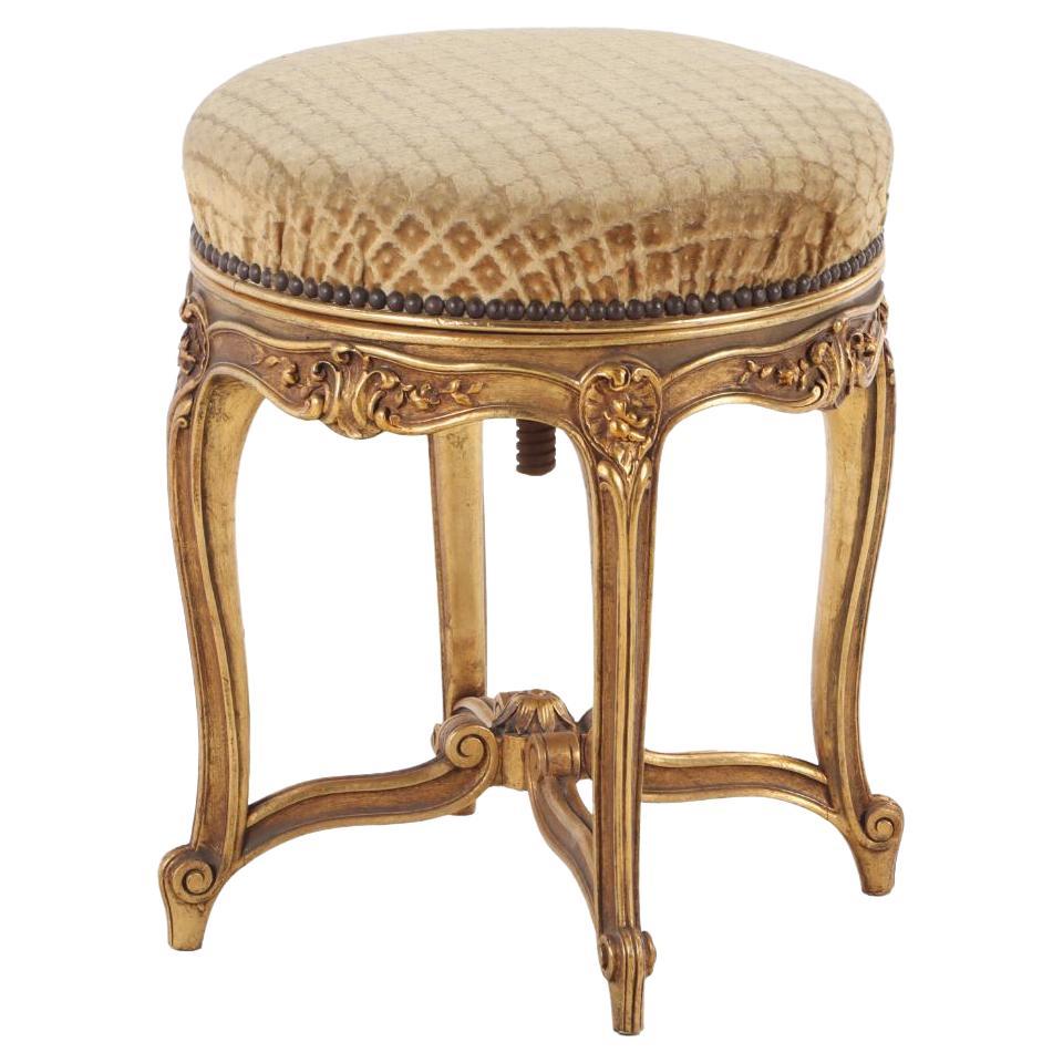 French Louis XV style giltwood and upholstered piano stool C 1900.