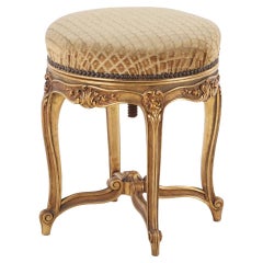 Antique French Louis XV style giltwood and upholstered piano stool C 1900.