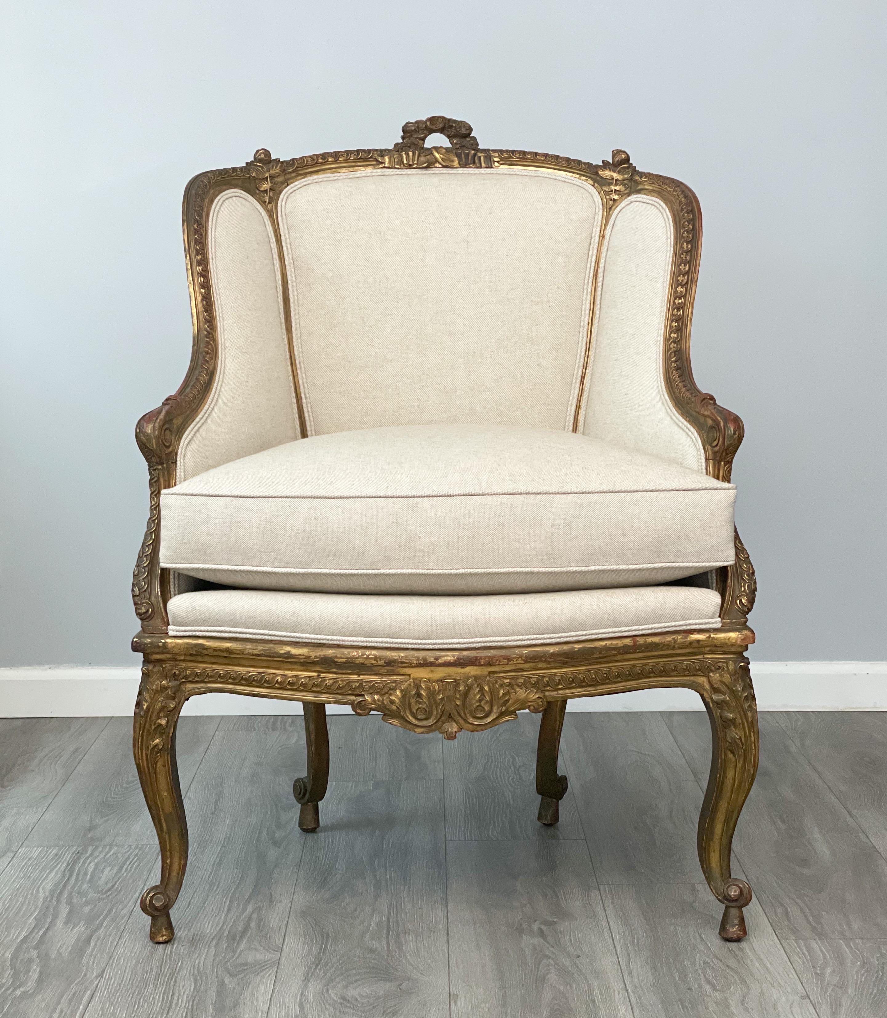 Beautiful, French 1920s bergere in the Louis XV style. 

The chair features a finely carved gilt-wood frame and new cotton linen canvas upholstery. Loose seat cushion. 

The chair is sturdy, sound and ready for many more years of use and