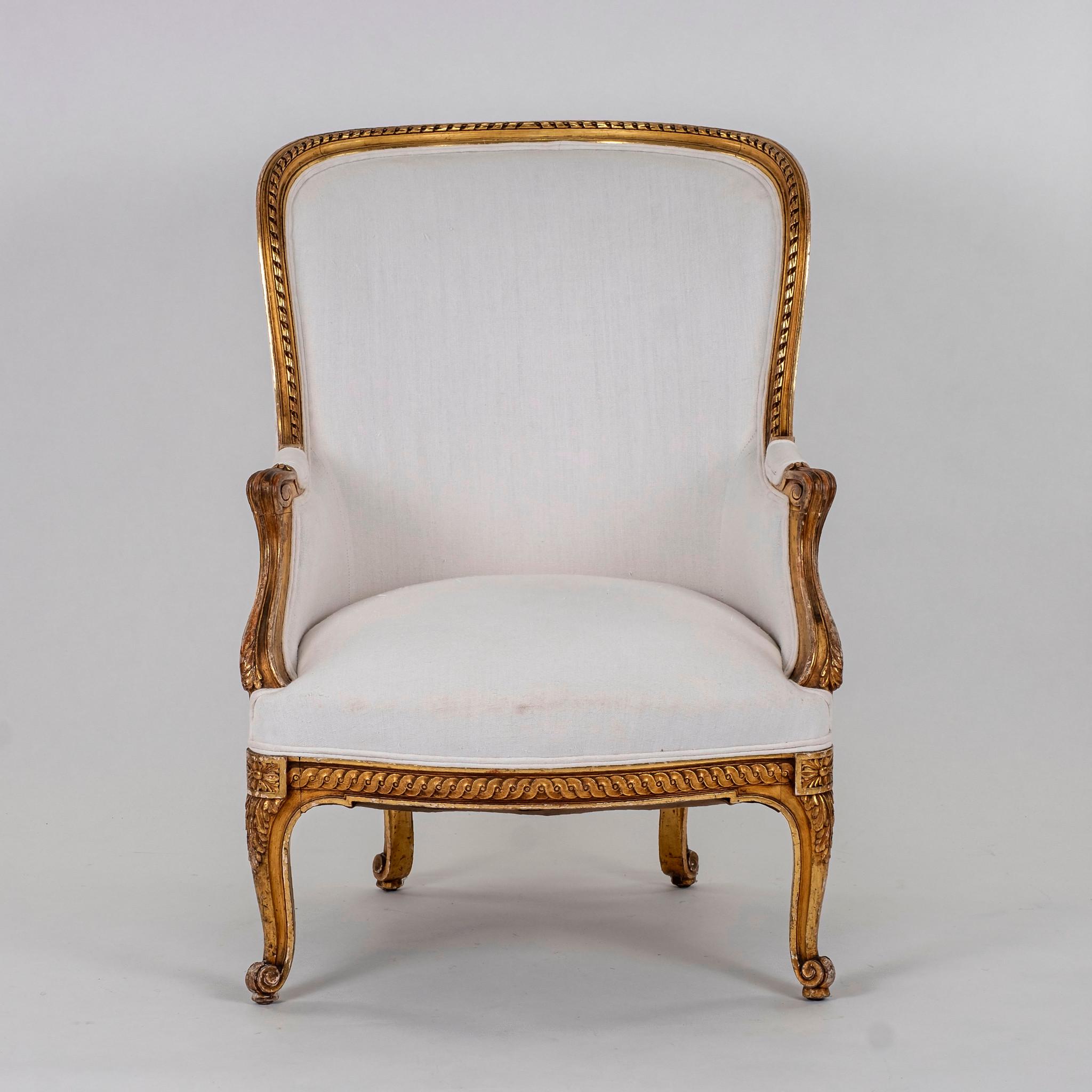 19th century giltwood bergere upholstered in white linen.