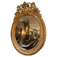 Antique French Louis XV-Style Giltwood Oval Beveled Mirror, 19th Century