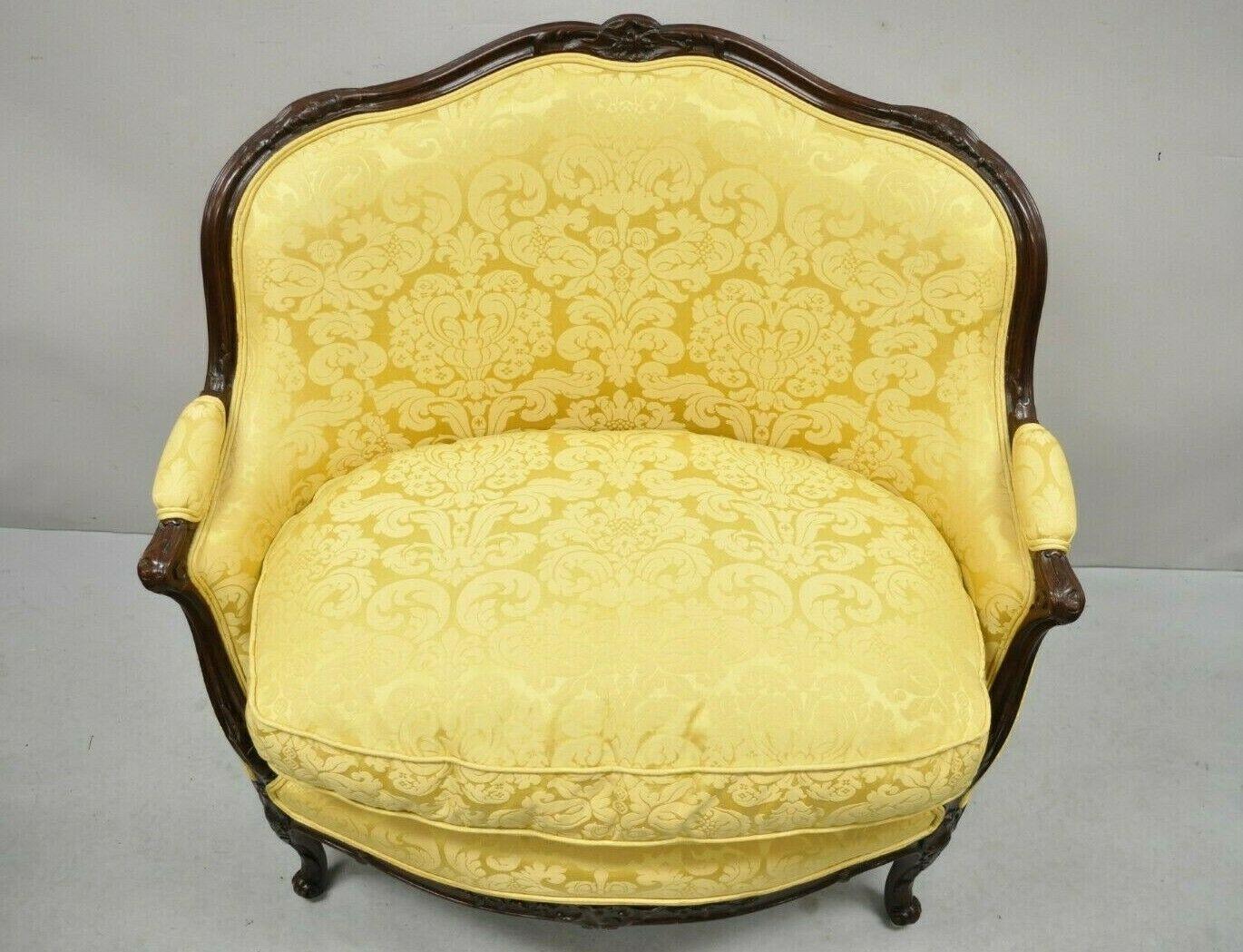 French Louis XV style gold upholstered wide seat lounge chair Settee Bergere. Item features a unique wide seat, gold floral print fabric, solid wood frame, beautiful wood grain, cabriole legs, very nice vintage item, great style and form. Circa Late