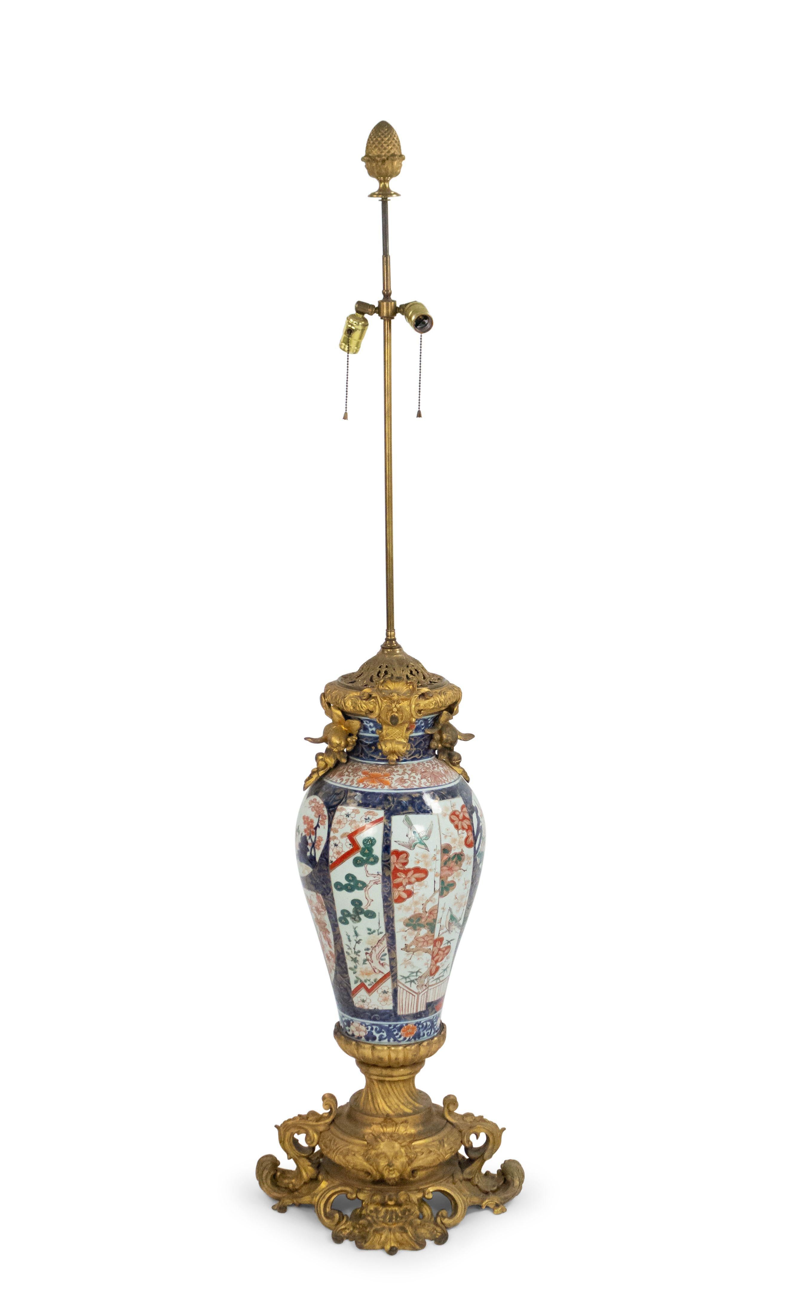 Pair of French Louis XV style (19th century) monumental Imari porcelain and bronze doré palace vases mounted as lamps.