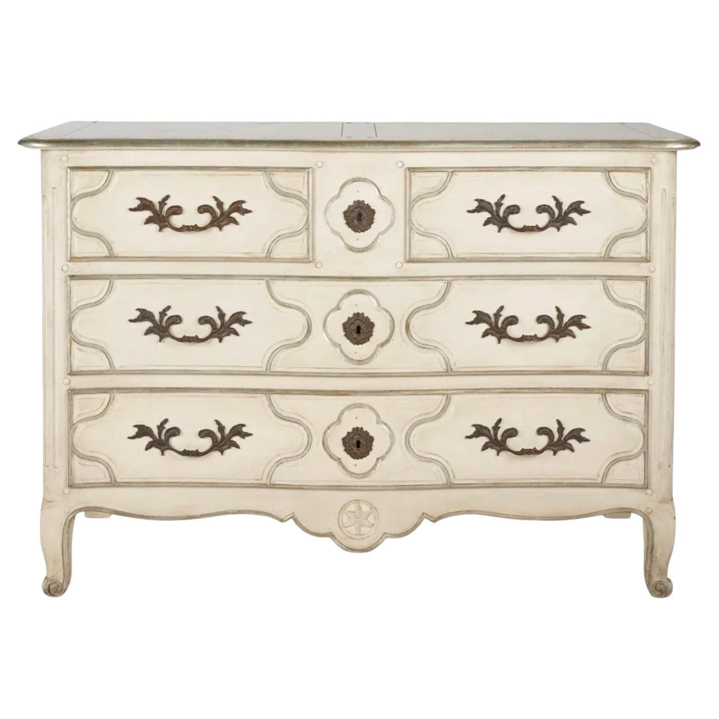 This is a French Louis XV style painted commode / chest by Baker Furniture Company. It has silver gilt and French gray accents and dovetail construction. It is in very good condition. 

My shipping is for the Continental US only and can run as much