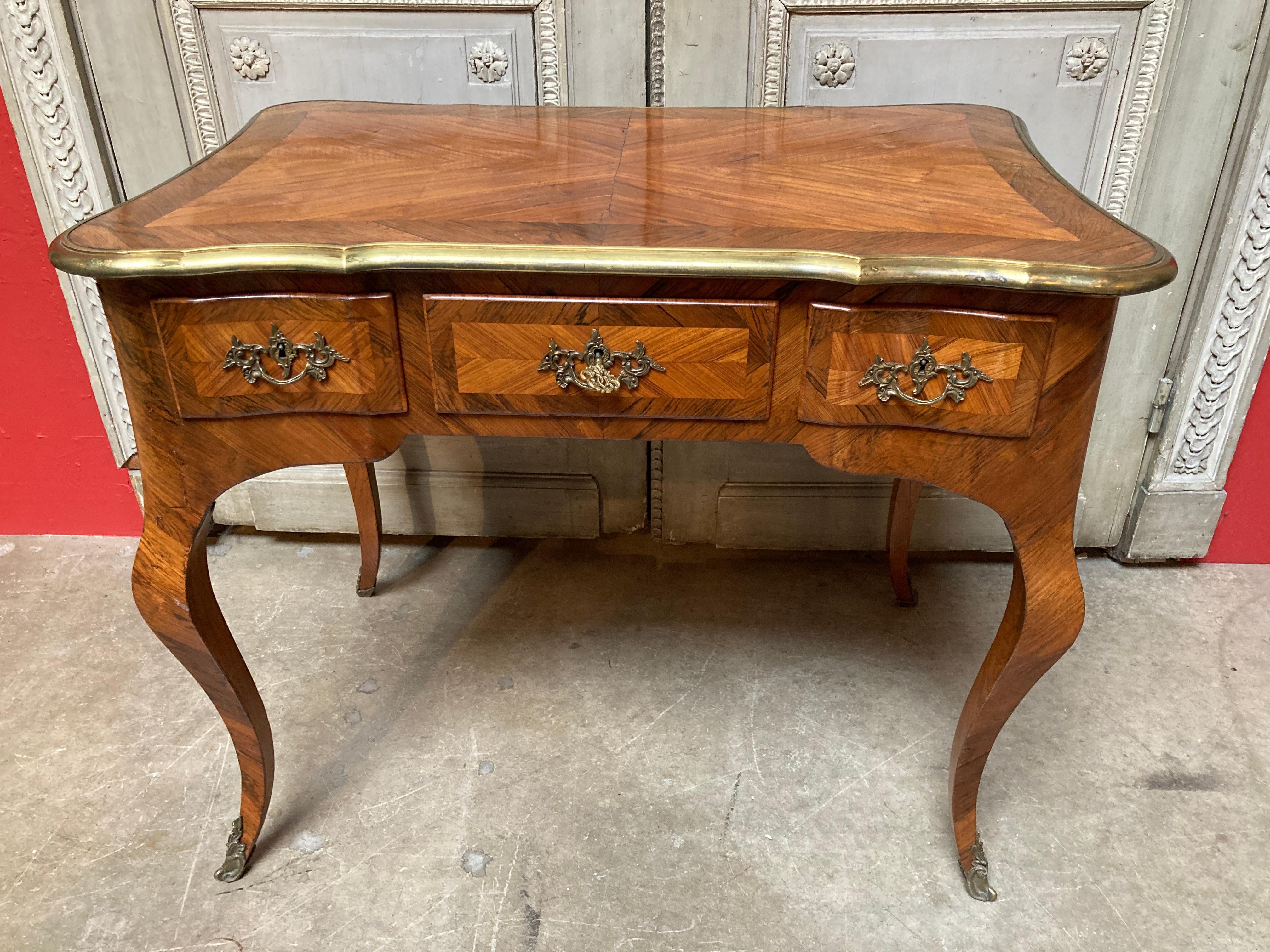 A 19th century French Louis XV style kingwood veneered parquetry writing table with bronze fittings.
The three drawer table is a wonderful small size and have a beautifully shaped top and cabriole legs.
This table was originally created as a