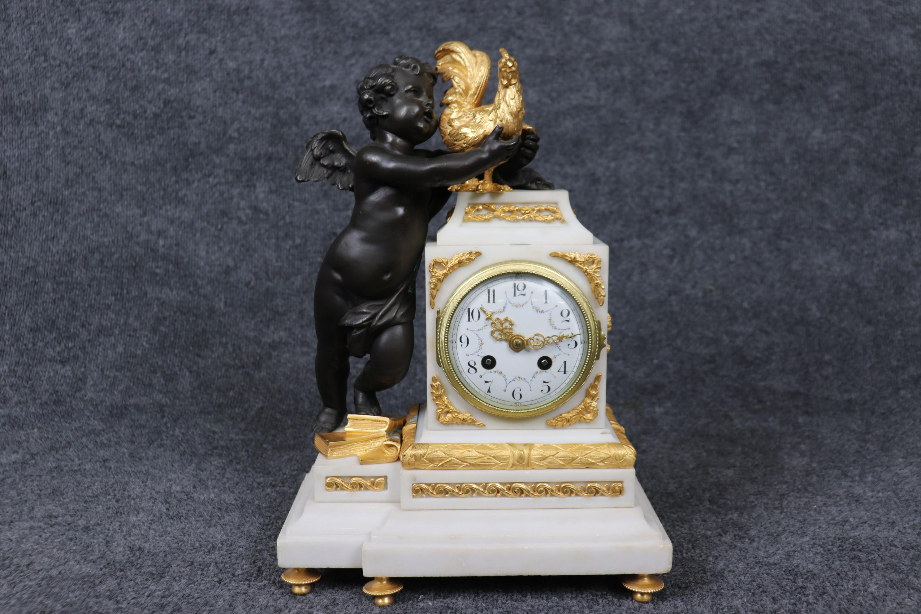 Dimensions - ( Clock - H: 15in W: 10 1/2in D: 6in ) ( Candelabras - H: 17 1/2in W: 10in D: 6 1/2in )

This antique French Samuel Marti Louis XV style figural marble and bronze mounted clock set is nothing but exceptional! This clock set is made of