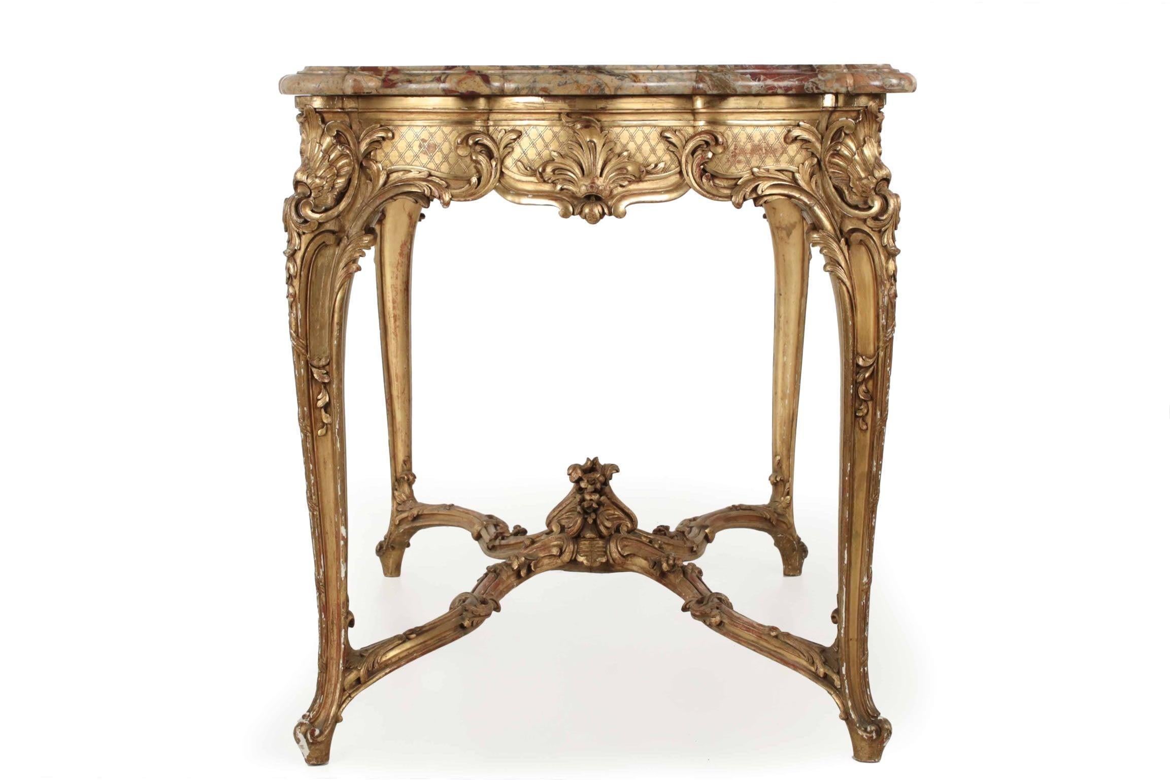 Of inordinately fine quality and presence, this exceptional Parisian center table is a powerful example of the exuberance for early designs during the Belle Époque. It is ceaselessly ornamented with a latticework ground and furls of acanthus with