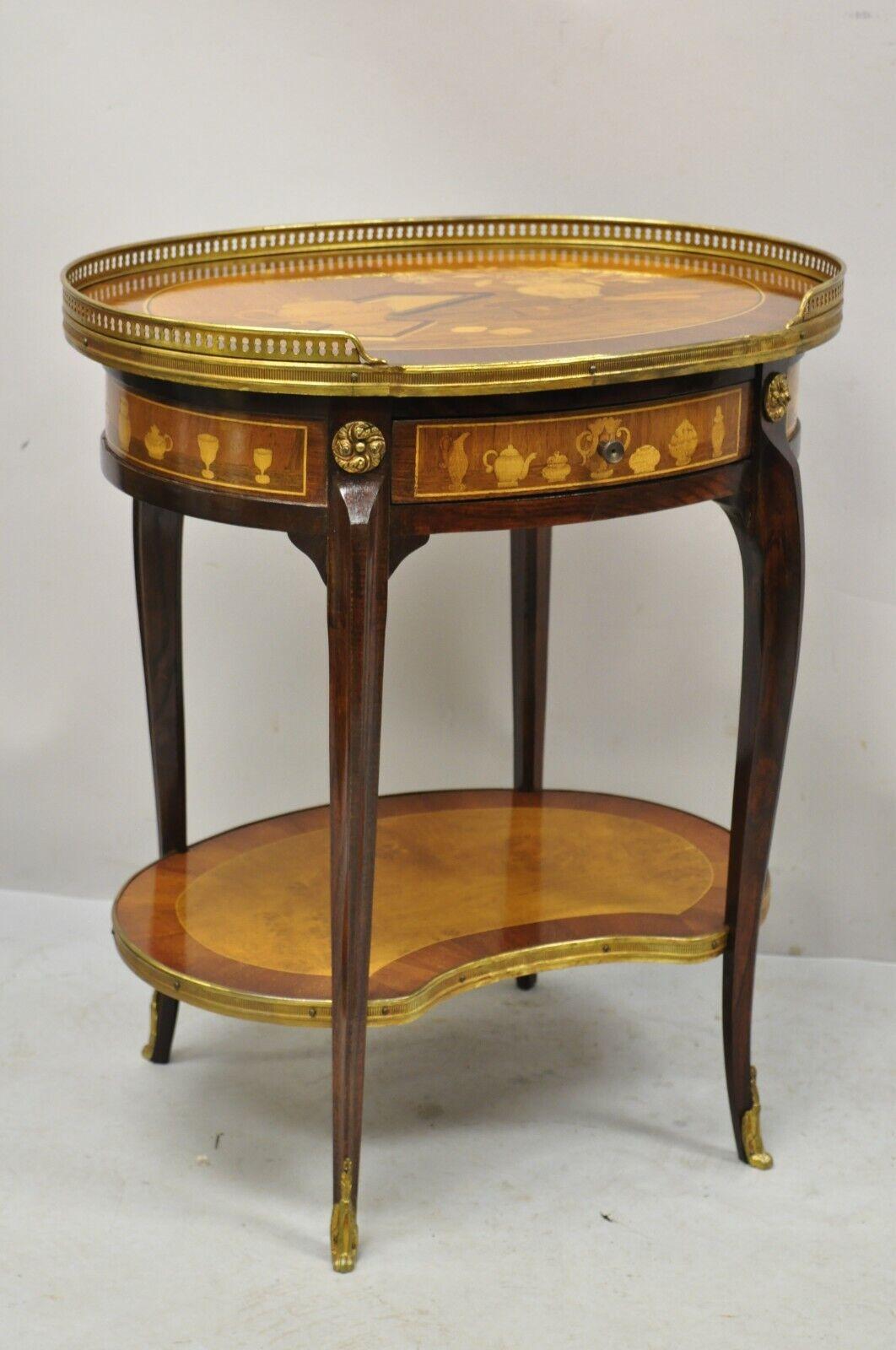 French Louis XV Style Marquetry Inlay Bronze Ormolu Accent Side Table. Item features marquetry inlay of still life scene to top, brass gallery, brass ormolu, lower shelf, 1 drawer, very nice vintage item, quality craftsmanship, great style and form.