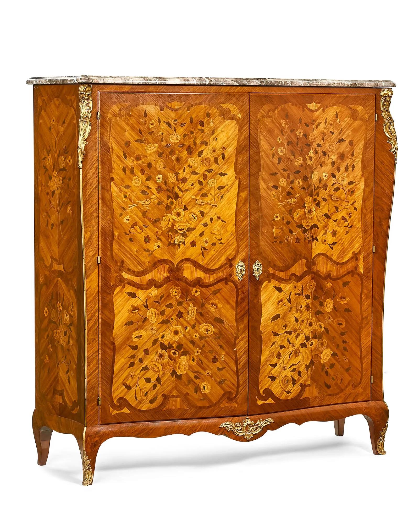 Antique  Late 19th Century French Louis XV style gilt bronze mounted kingwood, tulipwood, walnut, birch marquetry & inlay two door cabinet surmounted by a variegated marble top, the interior with three removable, adjustable shelves over a pair of