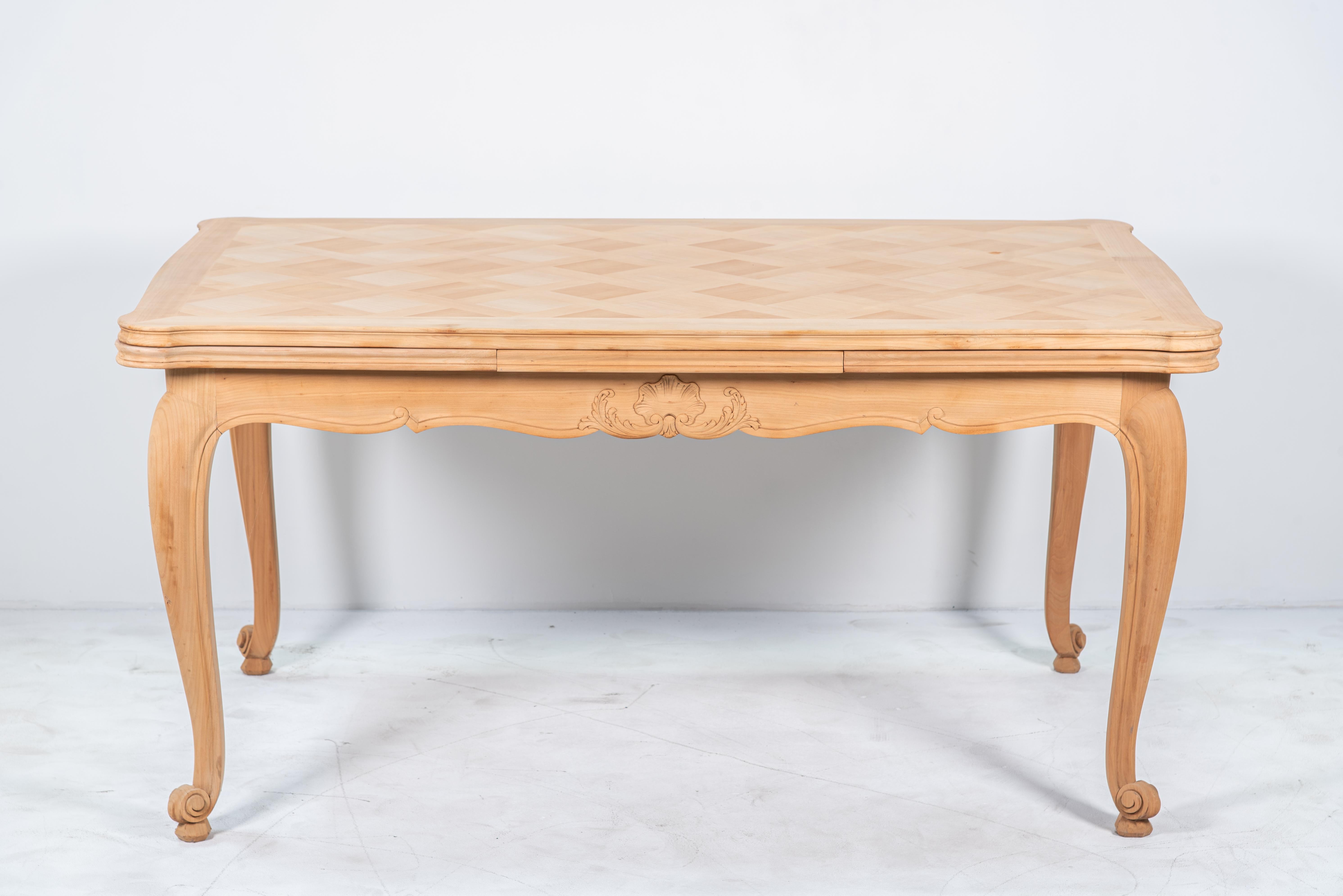 This exquisite French Louis XV Style Oak Dining Table is a stunning example of craftsmanship and timeless design. Featuring a magnificent parquet de Versailles top, this table is inspired by the grandeur of French palaces, adding a regal touch to