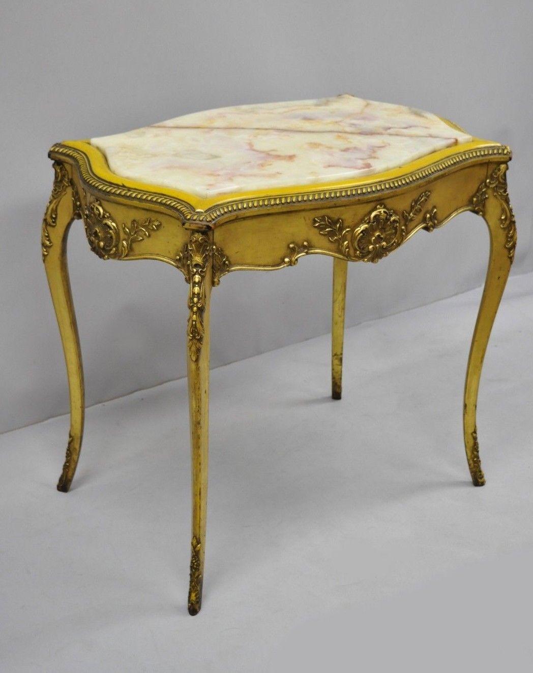 19th century French Louis XV style onyx stone turtle top table. Item features stunning shaped onyx stone top, shell carved and acanthus scrollwork gesso, yellow and gold finish, distressed finish, cabriole legs, very nice antique item, circa late