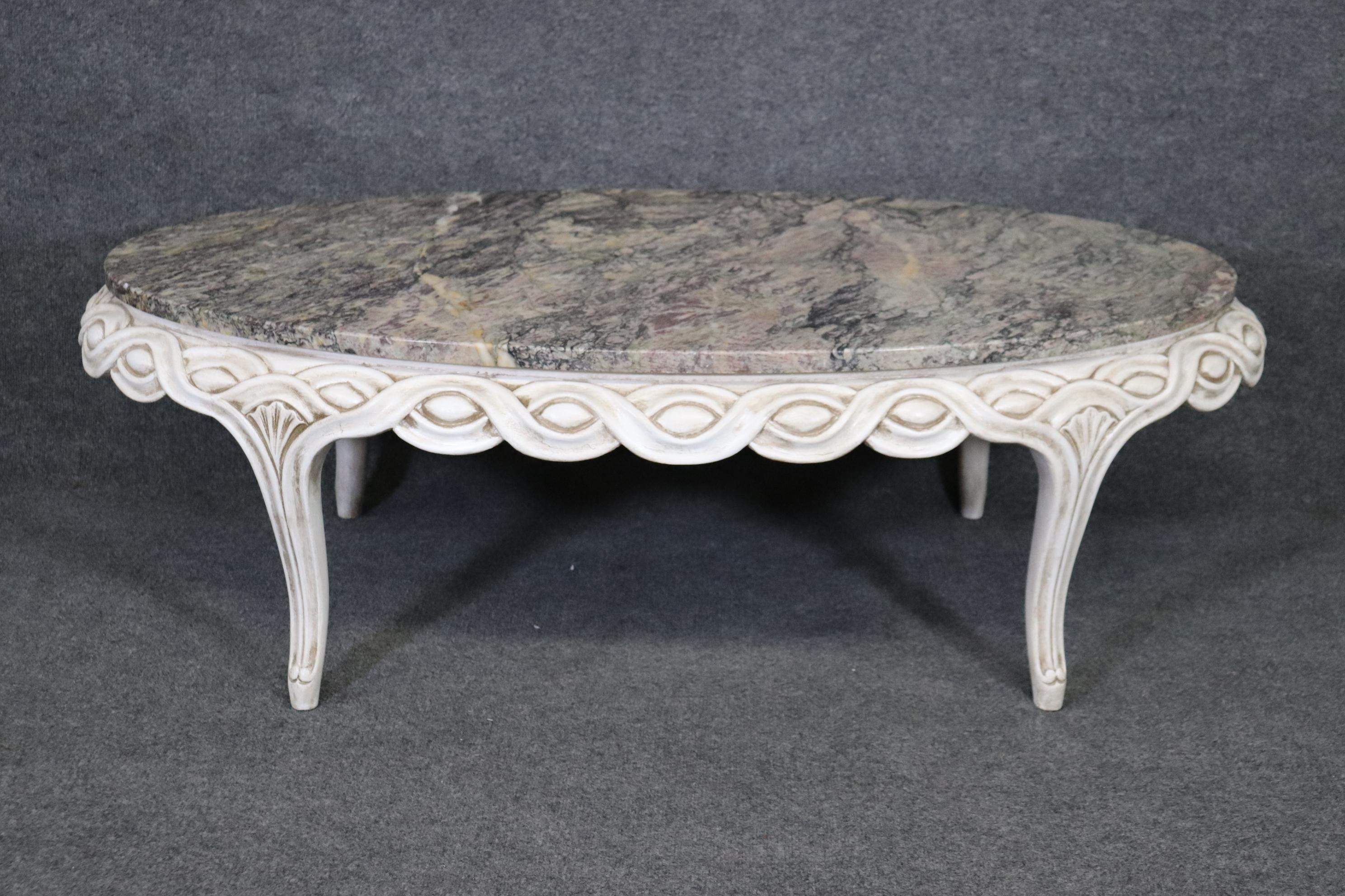 Dimensions- H: 17in W: 53in D: 28 1/2in 
This French Louis XV Style Paint Decorated Marble Top Coffee Table is made of the highest quality and is perfect for you and your home! If you look at the photos provided you will see the beautiful carved