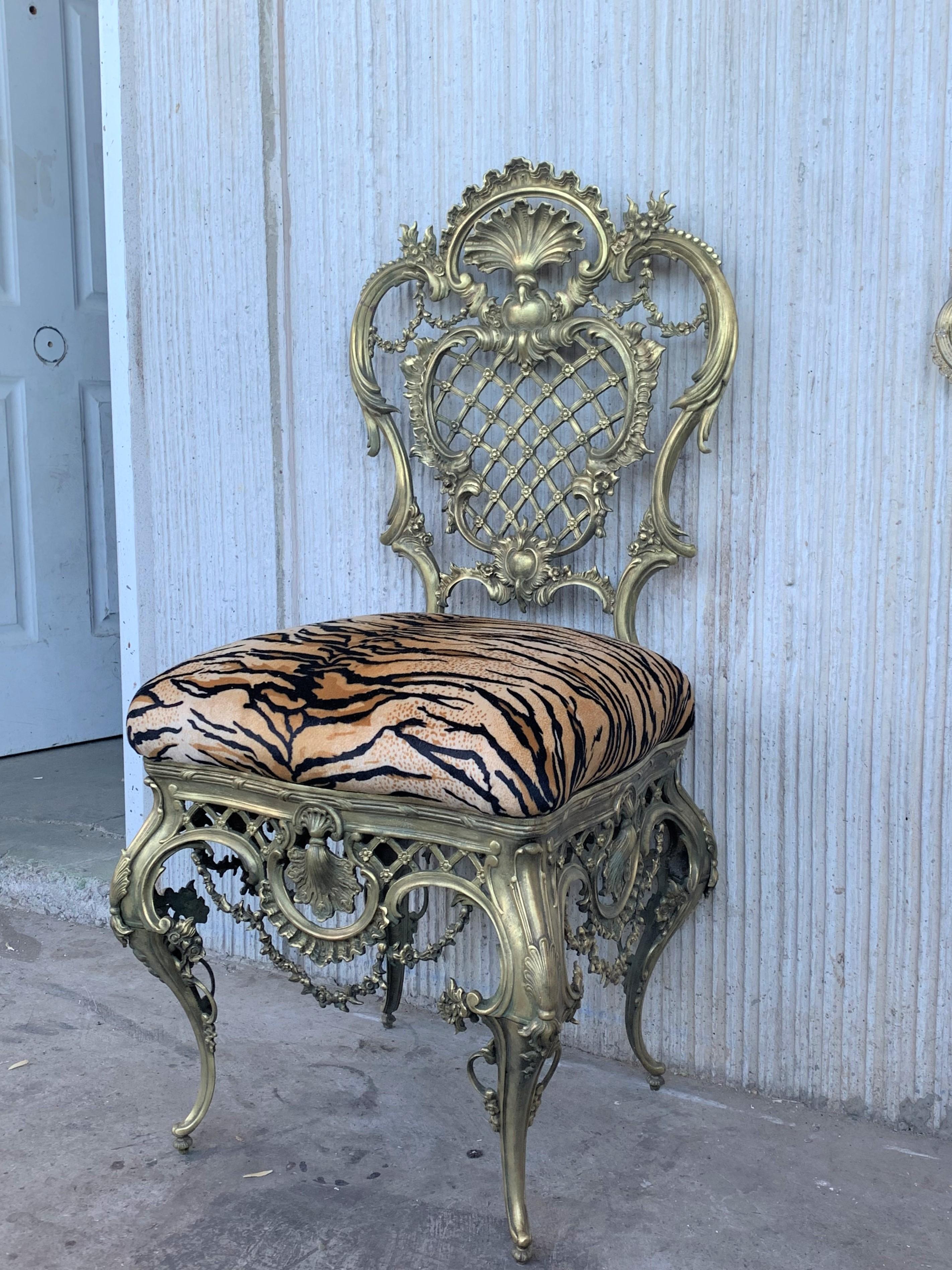 Pair of fine bronze Louis XVI style side chairs. This is a simply magnificent pair of Maison Jansen fashioned solid bronze side chairs. This pair having recently been cleaned. The solid tapering bronze legs having cookie cutter corners in the front