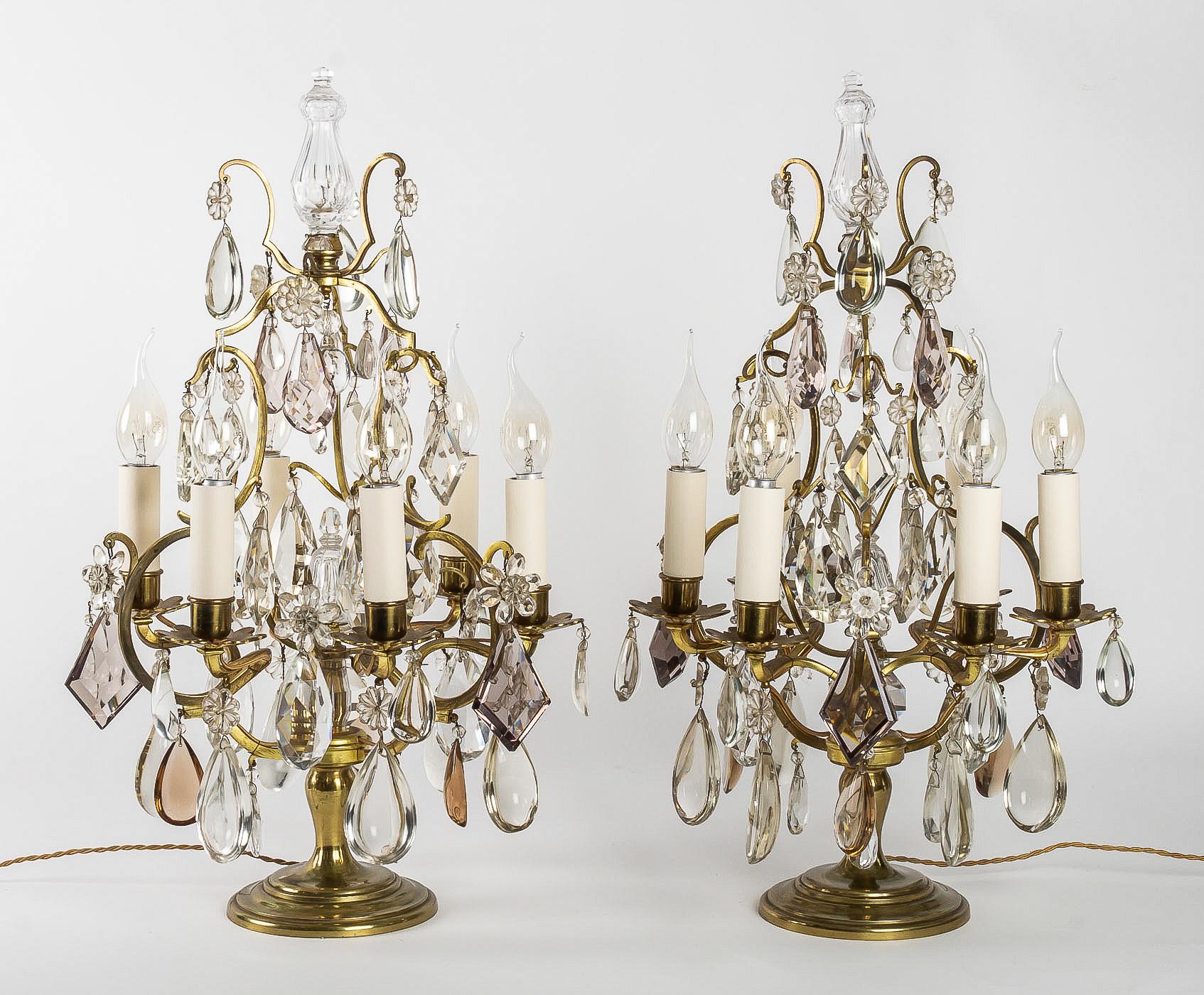 French Louis XV style, pair of gilt bronze girandole lamps, circa 1900

Elegant and decorative pair of gilt bronze girandole candelabra lamps. 
Fine quality cut crystal decoration attributed to The Cristalleries de Baccarat with white and