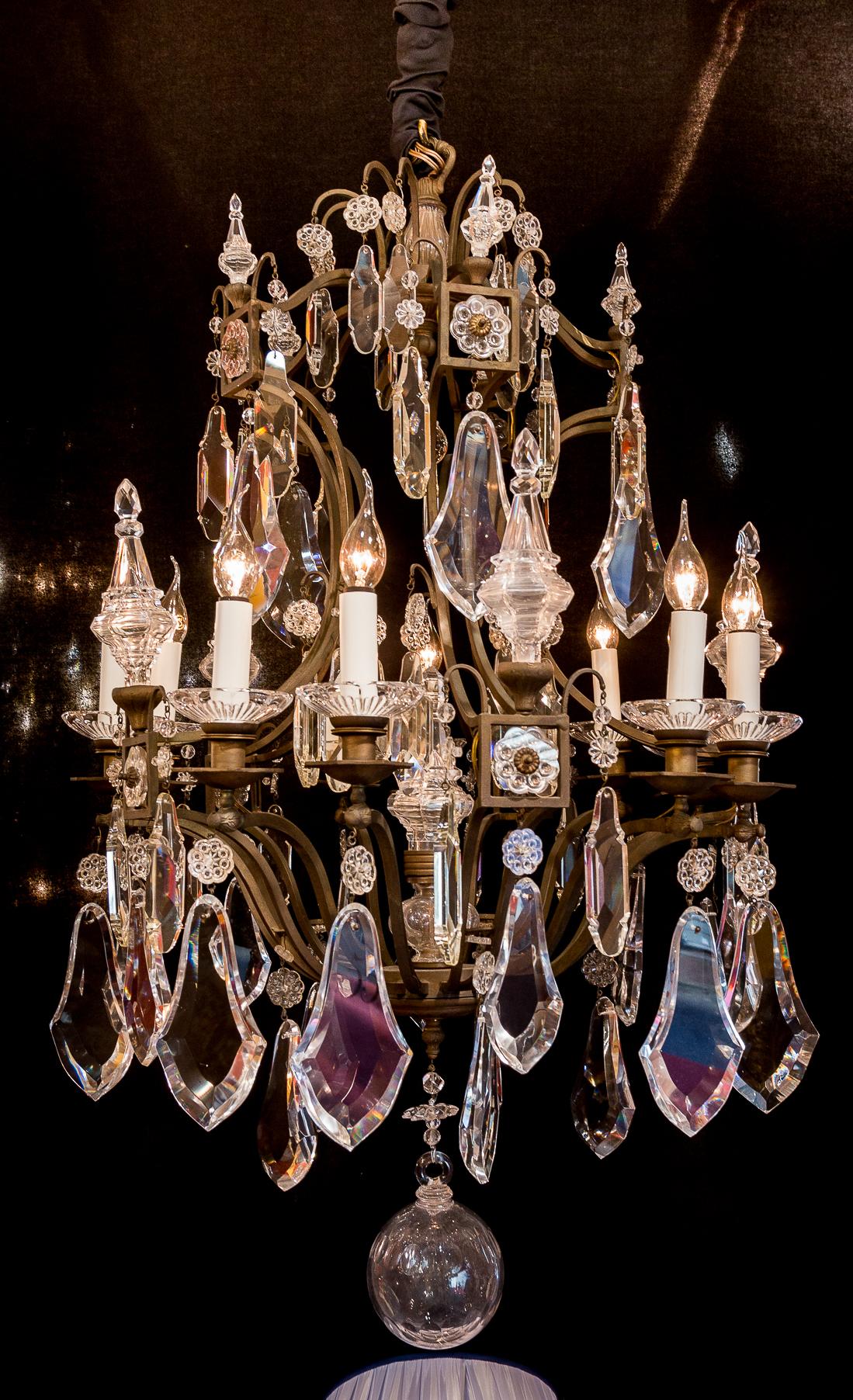 French Louis XV style, patinated bronze, and cut-crystal chandelier, circa 1950.

A beautiful patinated-bronze and hand cut-crystal, chandelier in the classic Louis XV style.
Our chandelier is composed of ten perimeter arm lights.
Excellent