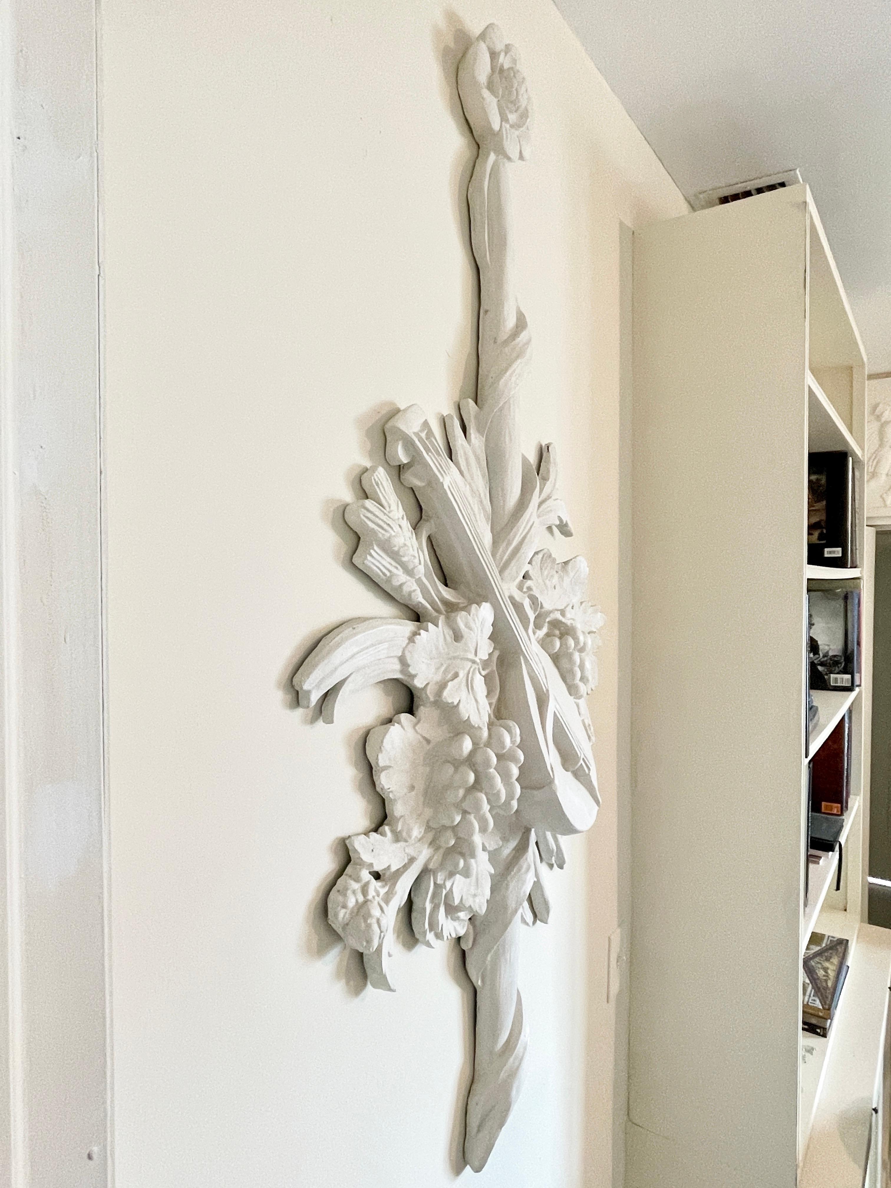 Beautiful French Louis XV style plaster wall decor depicting a n instrument and floral details. Very large scale and can add some French classical architecture to your home.