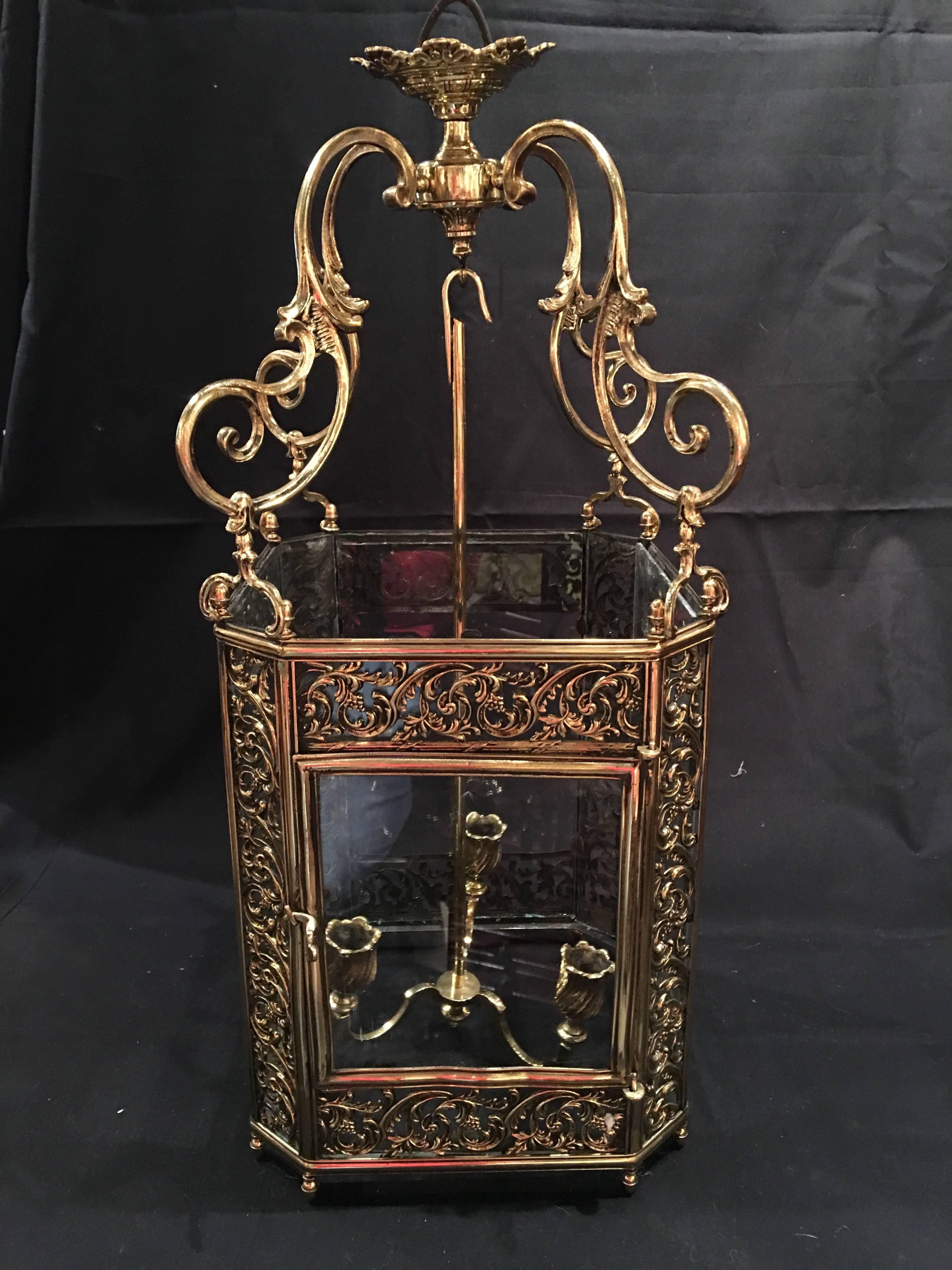 French Louis XV style Reticulated brass three-light lantern, 19th century. Currently it is not US wired but we can wire it at no additional cost.