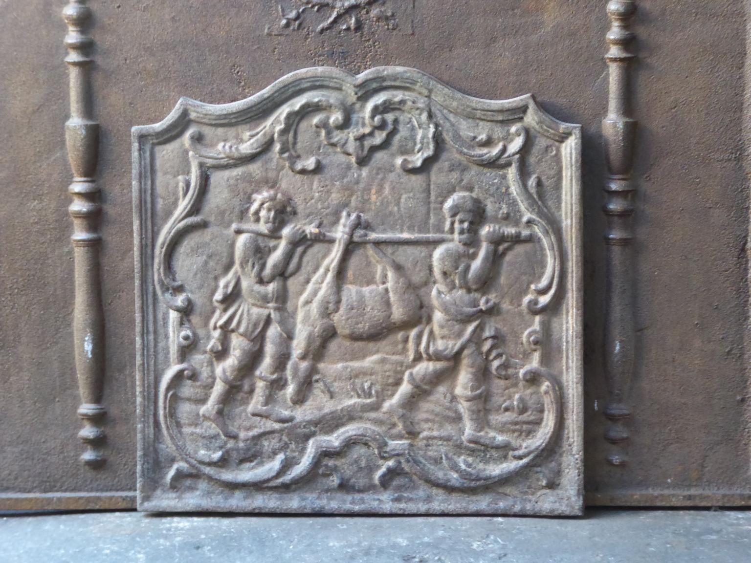 French Louis XV style fireback with hunters coming back from the hunt with a deer.

The fireback is made of cast iron and has a natural brown patina. Upon request it can be made black / pewter. The fireback is in a good condition and does not have
