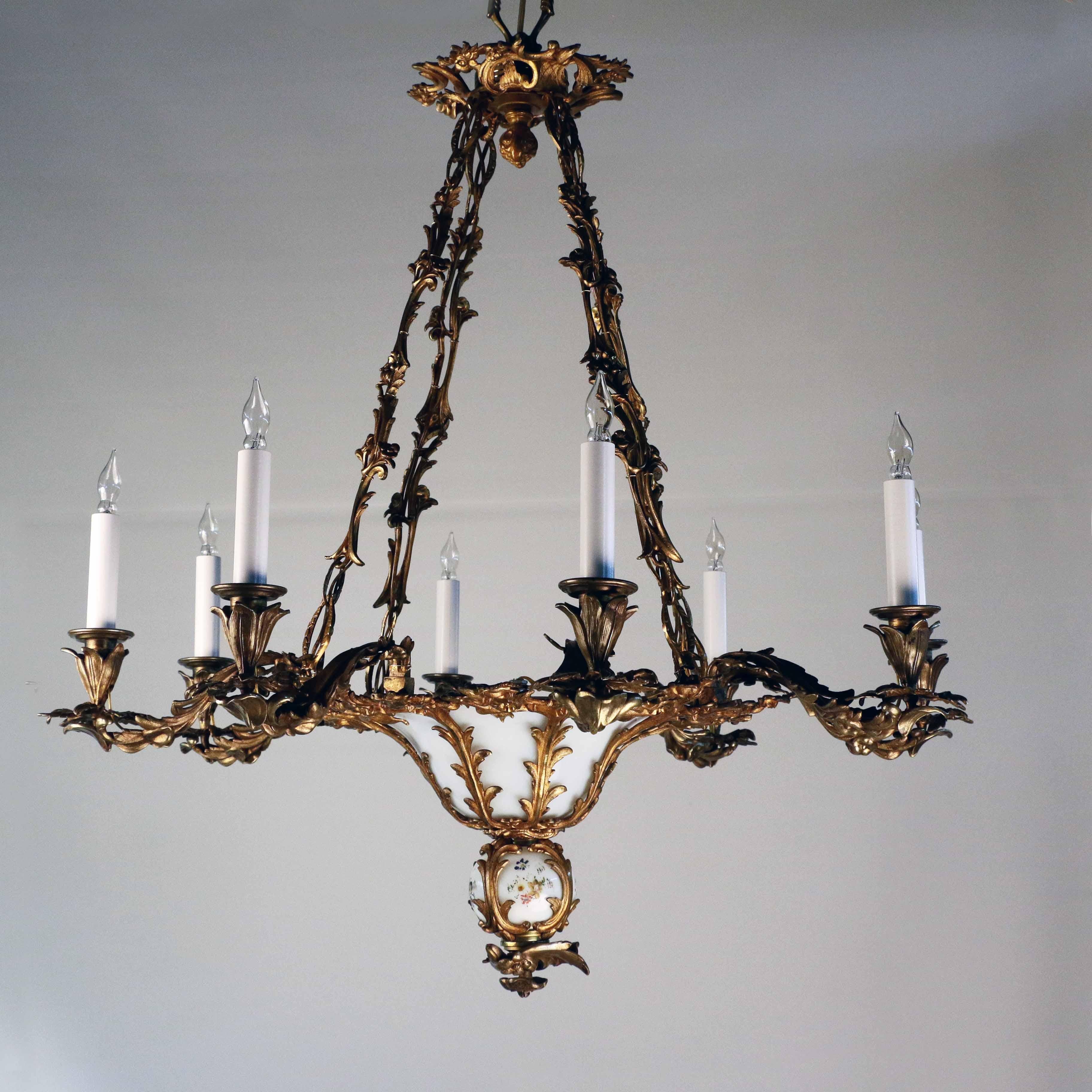 This elegant chandelier dates from the third quarter of the 19th century, It was made for candles but we wired it (without damaging it) for your greater convenience. Its overall feel is one of openness and naturalistism. The suspension chains are