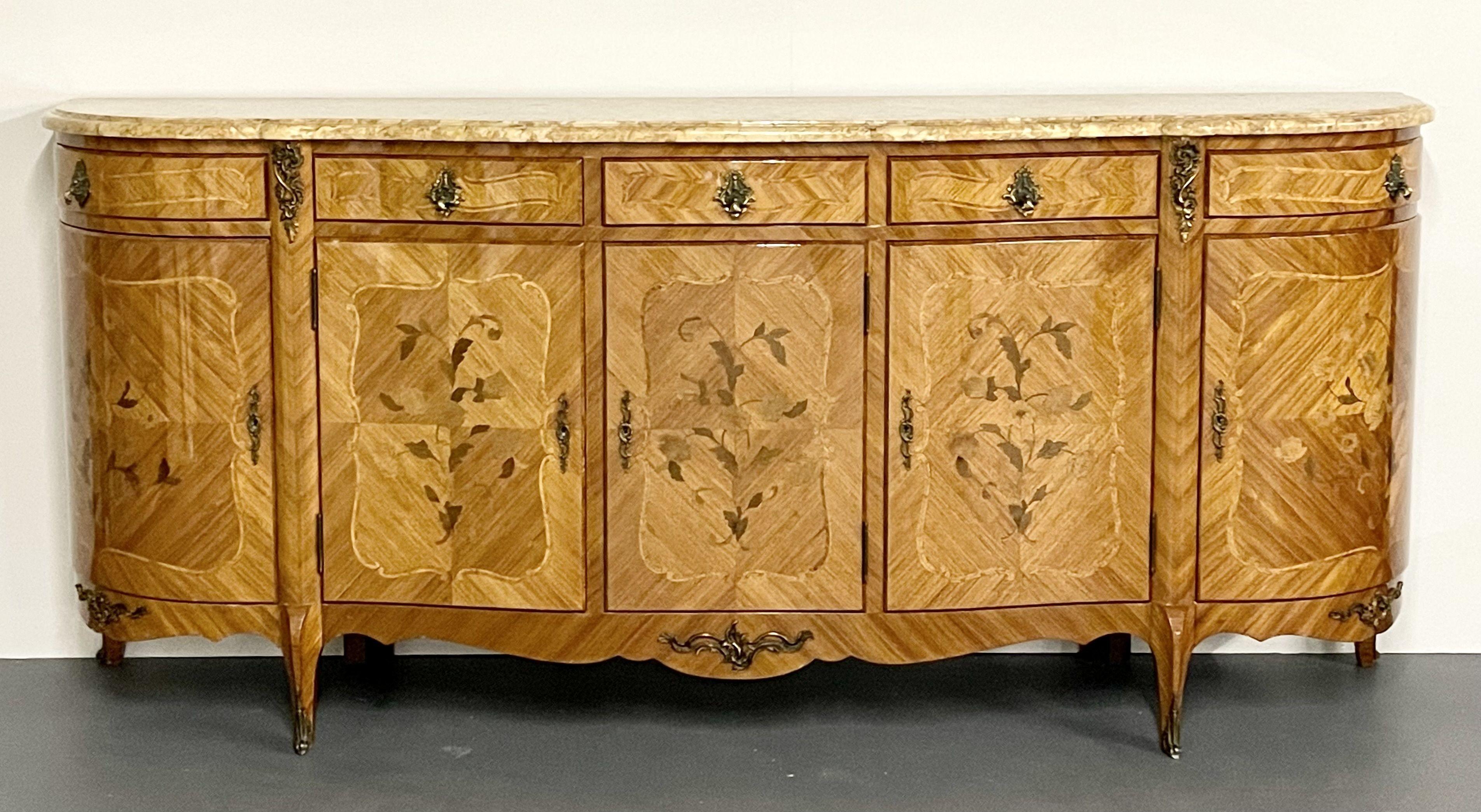 A French Inlaid Louis XV style sideboard, Credenza, Buffet of Monumental Form having a 1 1/4 inch think marble top supported by a vintage custom cabinet maker case having five bowed doors all with inlaid floral decoration. Each door having fitted