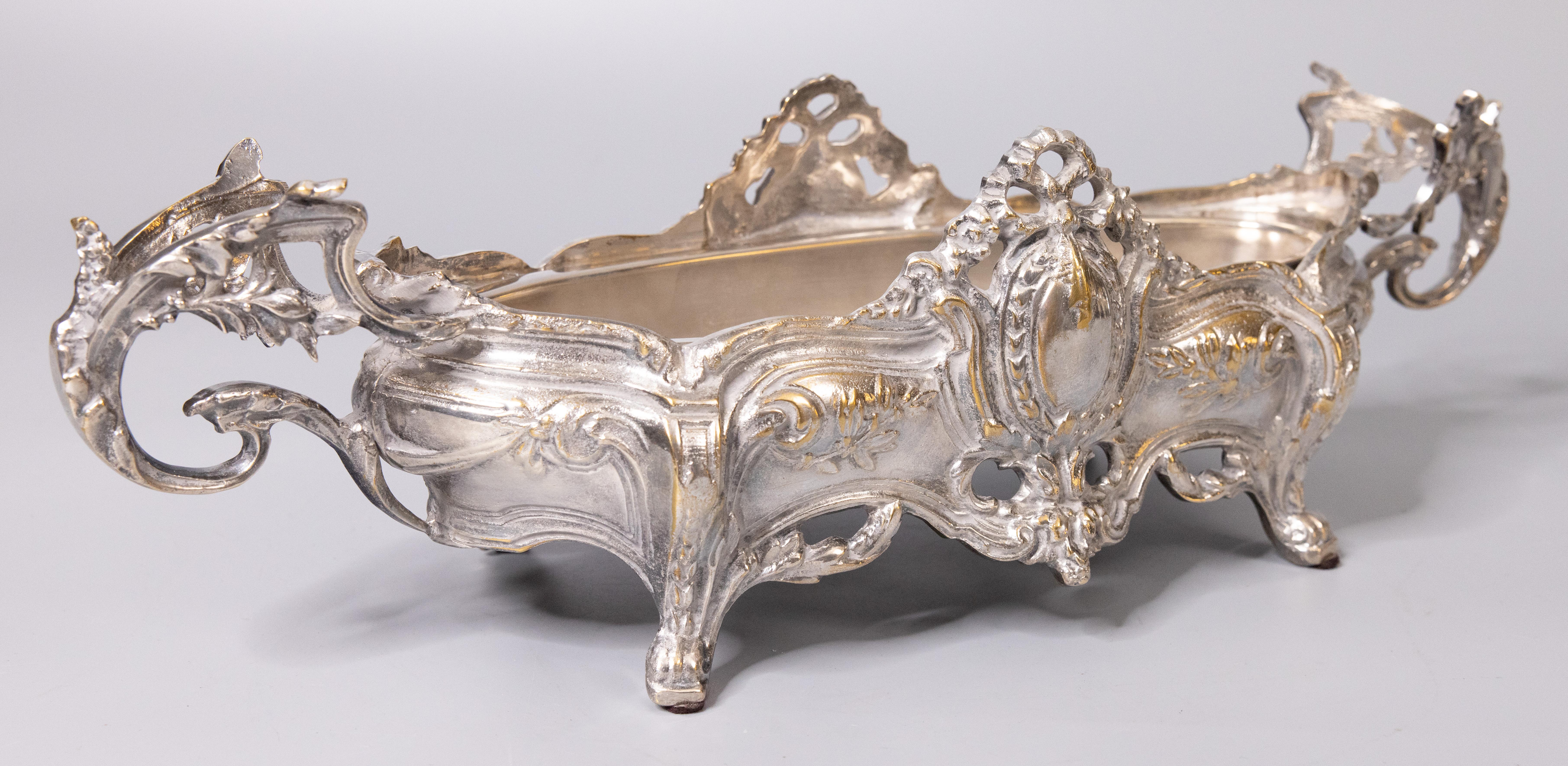 A gorgeous antique French Louis XV style silverplate footed cache pot / jardiniere / planter with the original removable silverplated liner, circa 1900. No maker's mark. This stunning cachepot is a nice large size and heavy, weighing an impressive 7