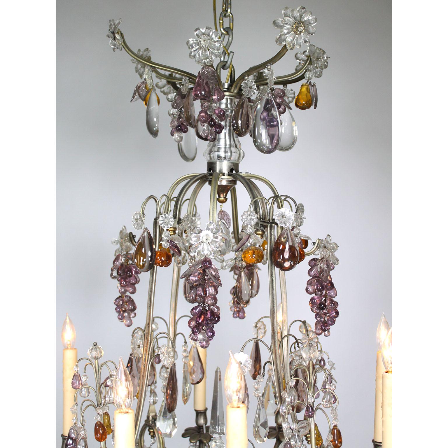 A Very Fine French Belle Époque 19th/20th Century Louis XV Style Eight-Light Silvered-bronze and Colored-Crystal Chandelier with amethyst grape clusters and molded glass pendants of fruit leaves, apples, pears and flowers. Circa: Paris,