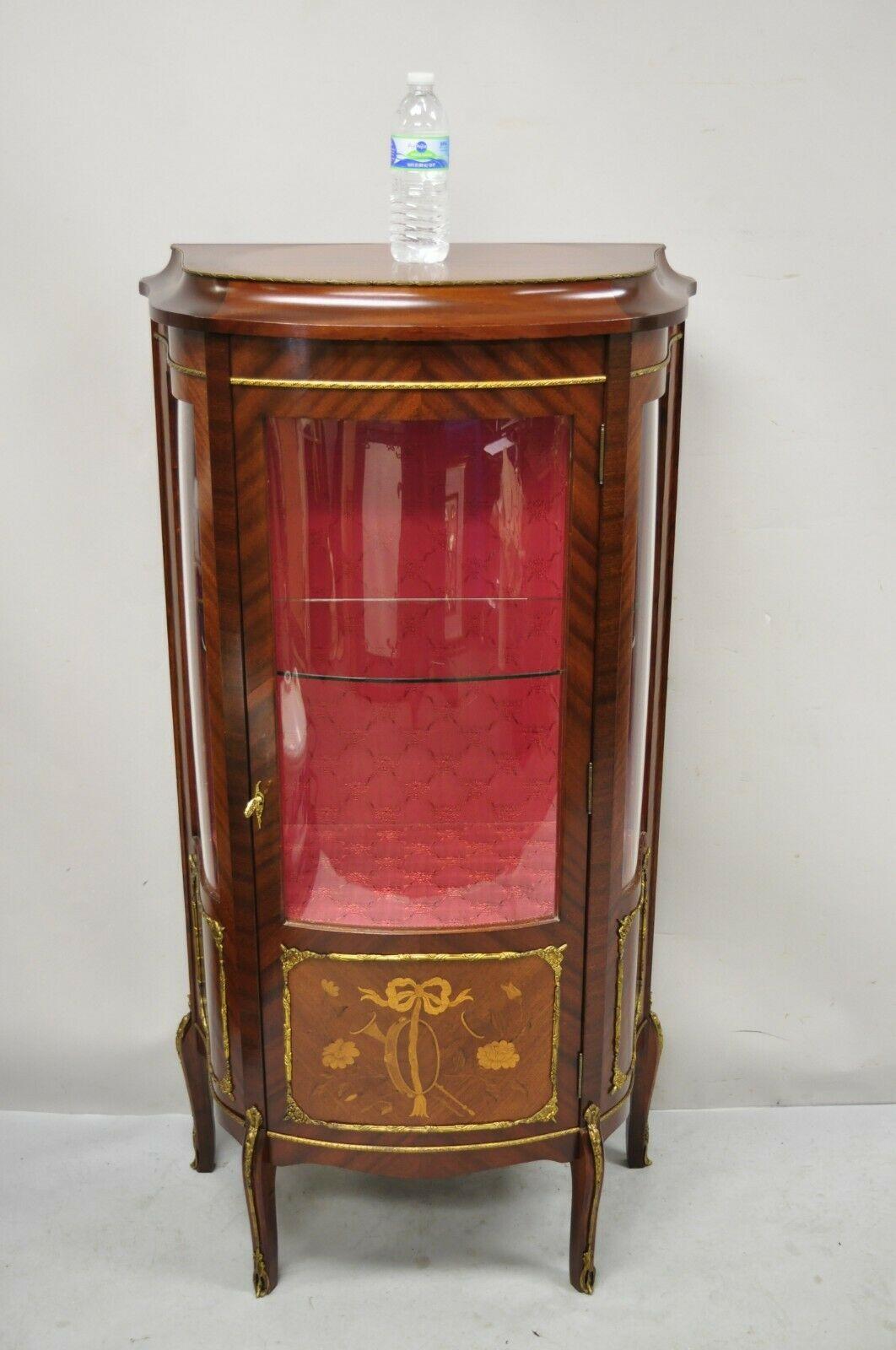French Louis XV Style Small Curio Display Cabinet Bowed Glass and Inlay. Item features a curved bowed glass door and side panels, floral satinwood inlay, upholstered interior, bronze ormolu, beautiful wood grain,1 glass shelf, cabriole legs, quality