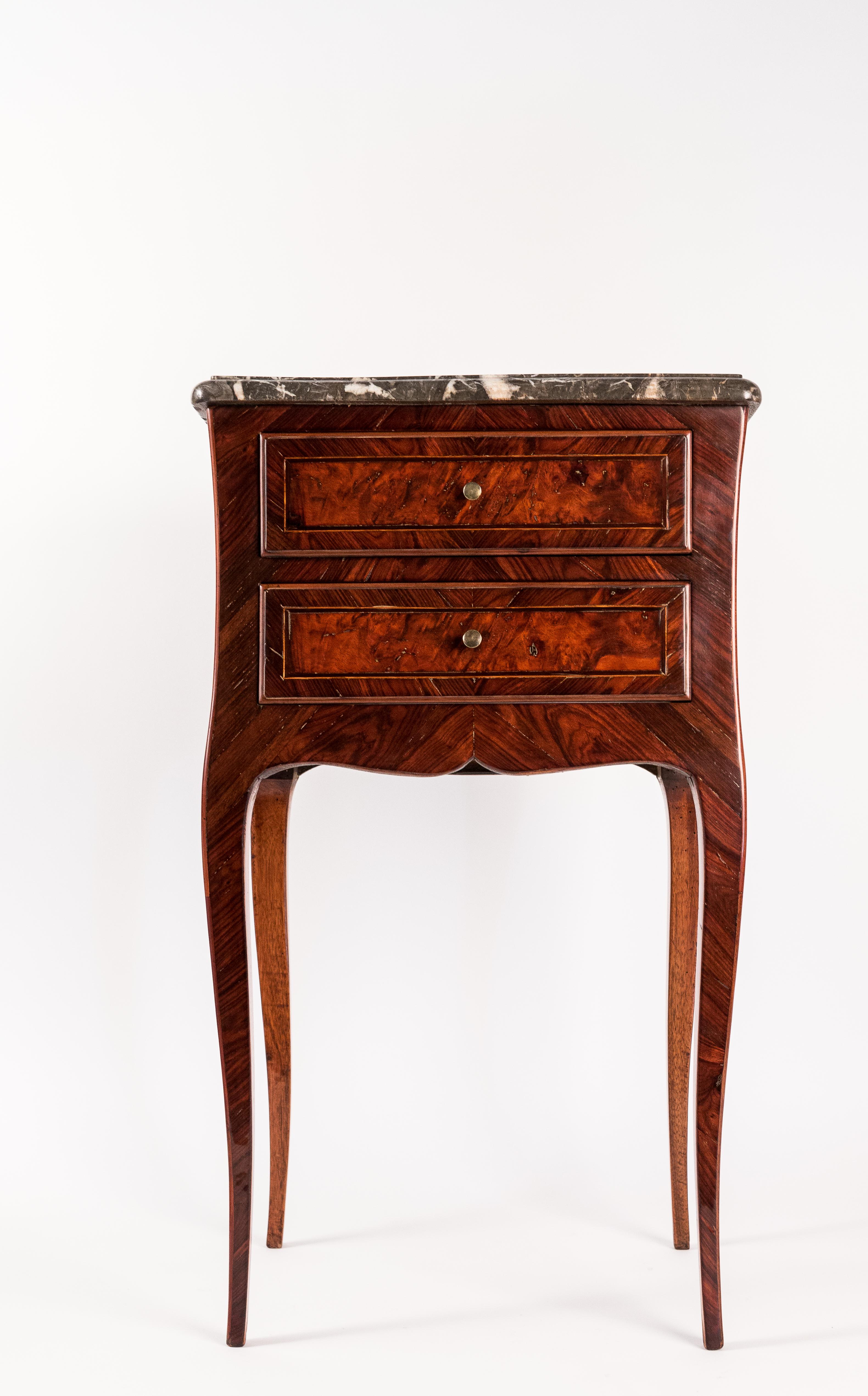 French Louis XV style small Serpentine marble-top commode, circa 1820-1830.

A lovely and decorative small commode in Kingwood and Amboyna. It opens by two drawers and rests on elegant cabriole legs, with 
