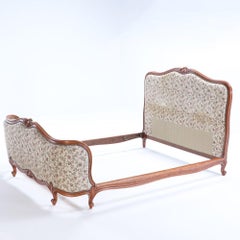 French Louis XV style upholstered bed with curved footboard C 1930.