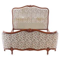 French Louis XV style upholstered bed with curved footboard C 1930.